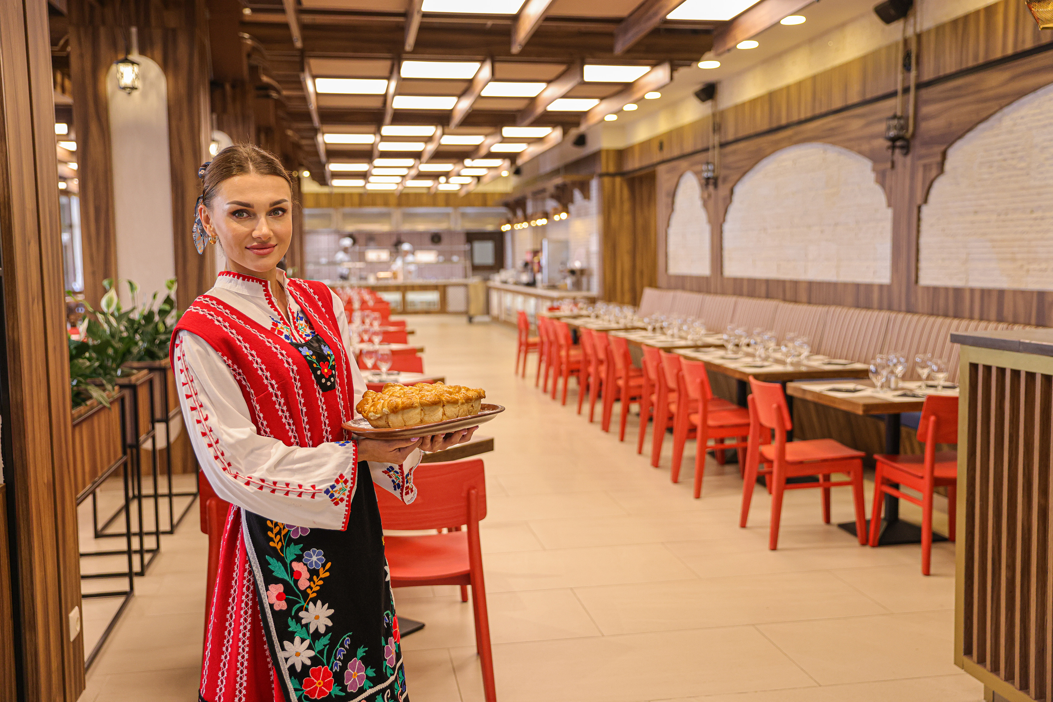 a woman holding a plate of food