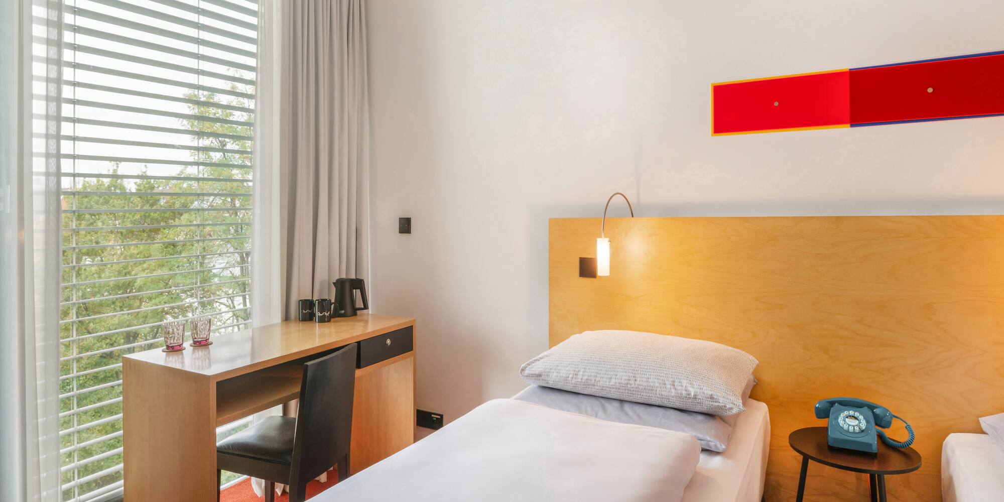 a bed and desk in a room