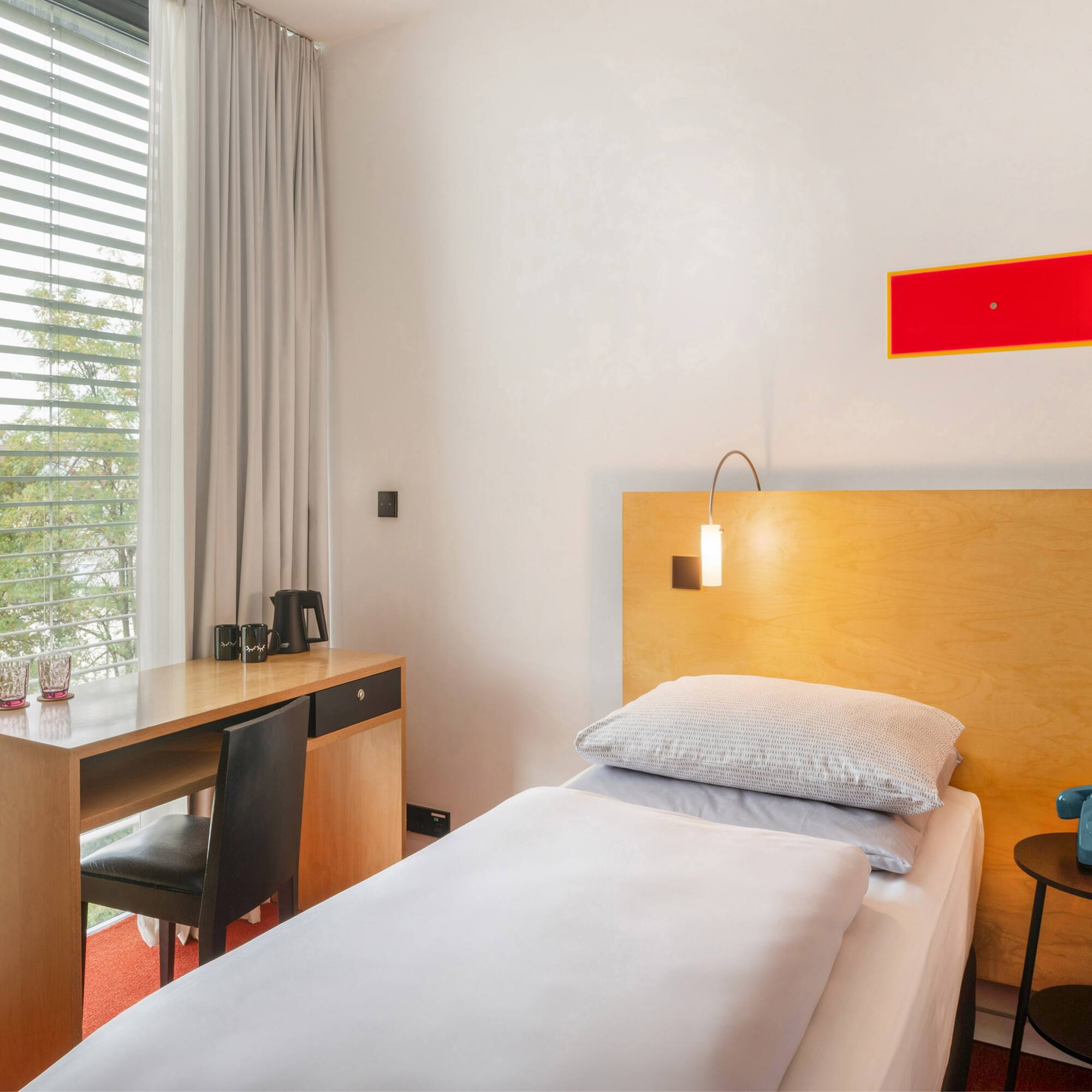 a bed and desk in a room