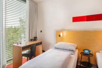 a bed and desk in a room