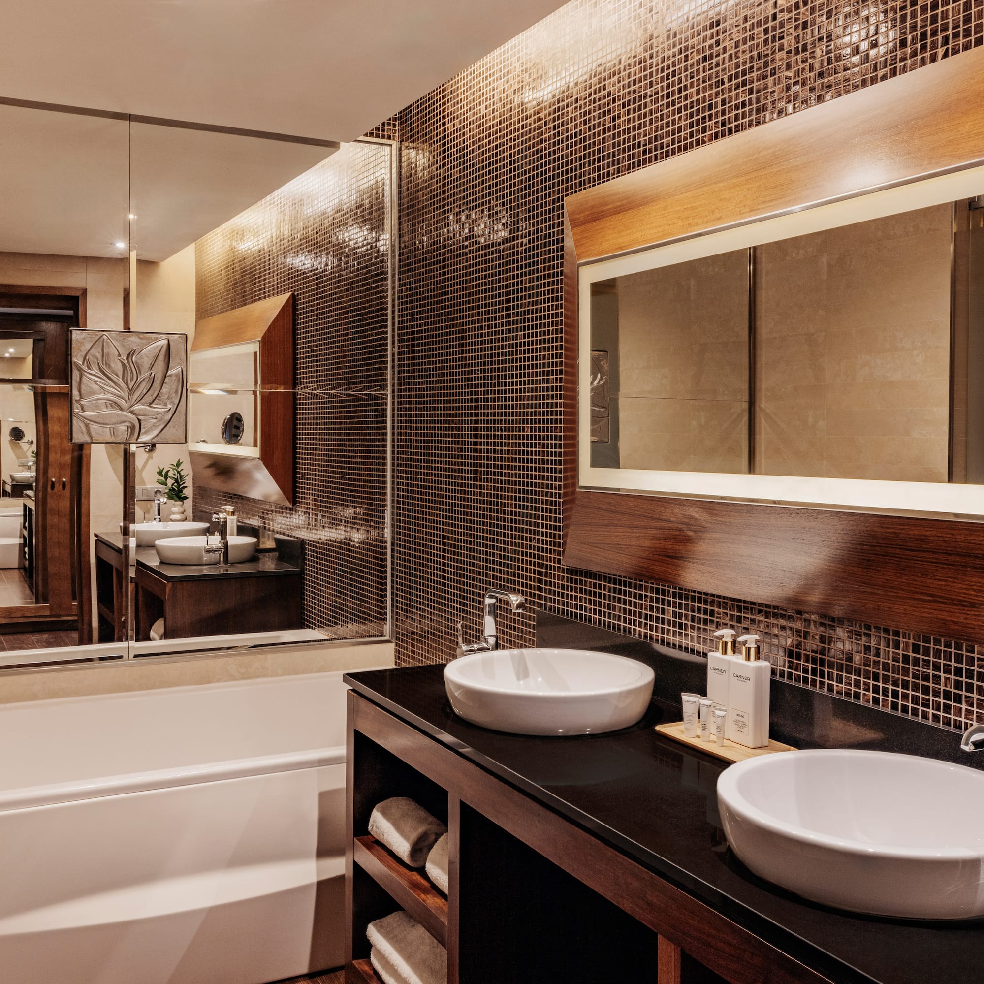 a bathroom with a mirror and sinks