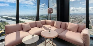 a couch and table with a view of a city