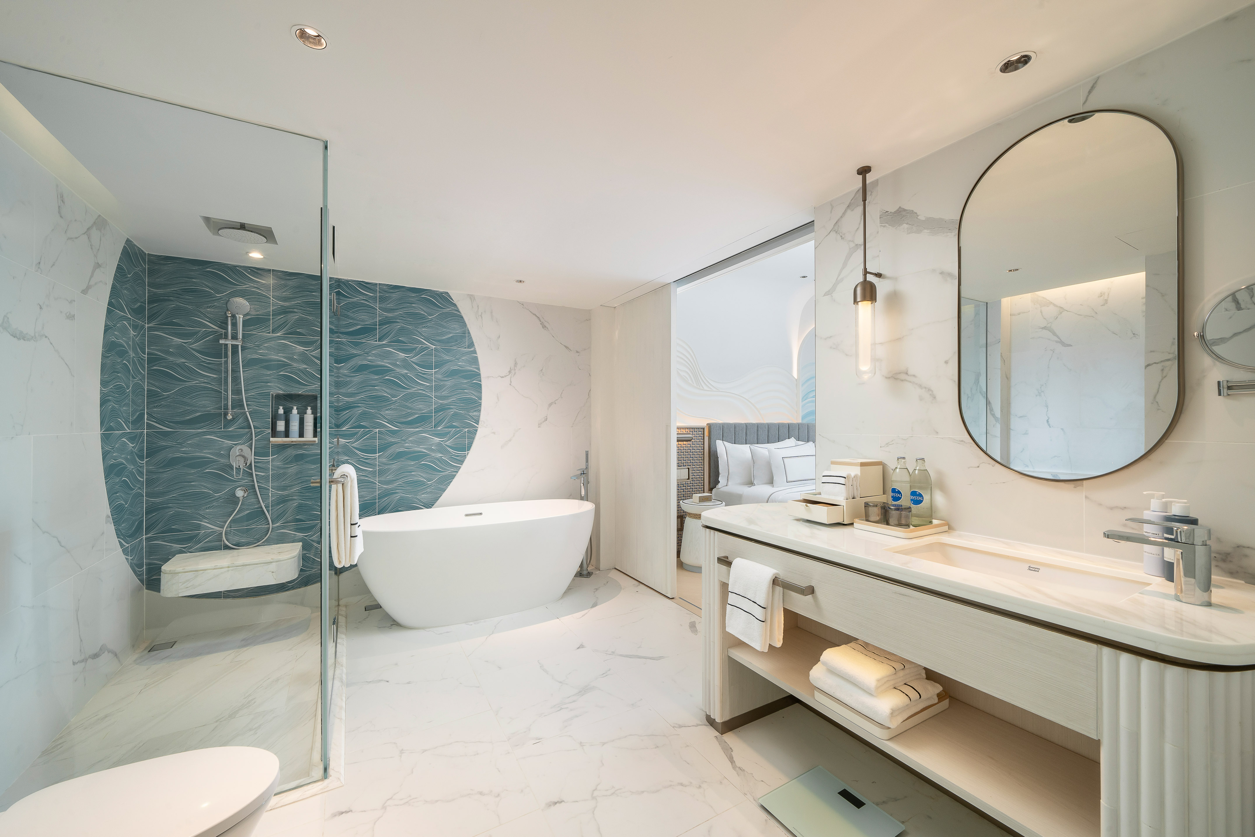 Modern hotel bathroom: freestanding tub, blue wave shower, marble vanity. - The Level 2 Bedroom Suite - Meliá Pattaya Hotel, Pattaya