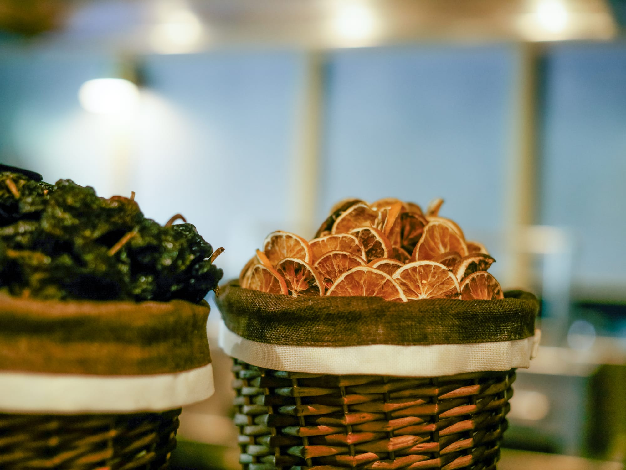 a group of baskets with dried fruit