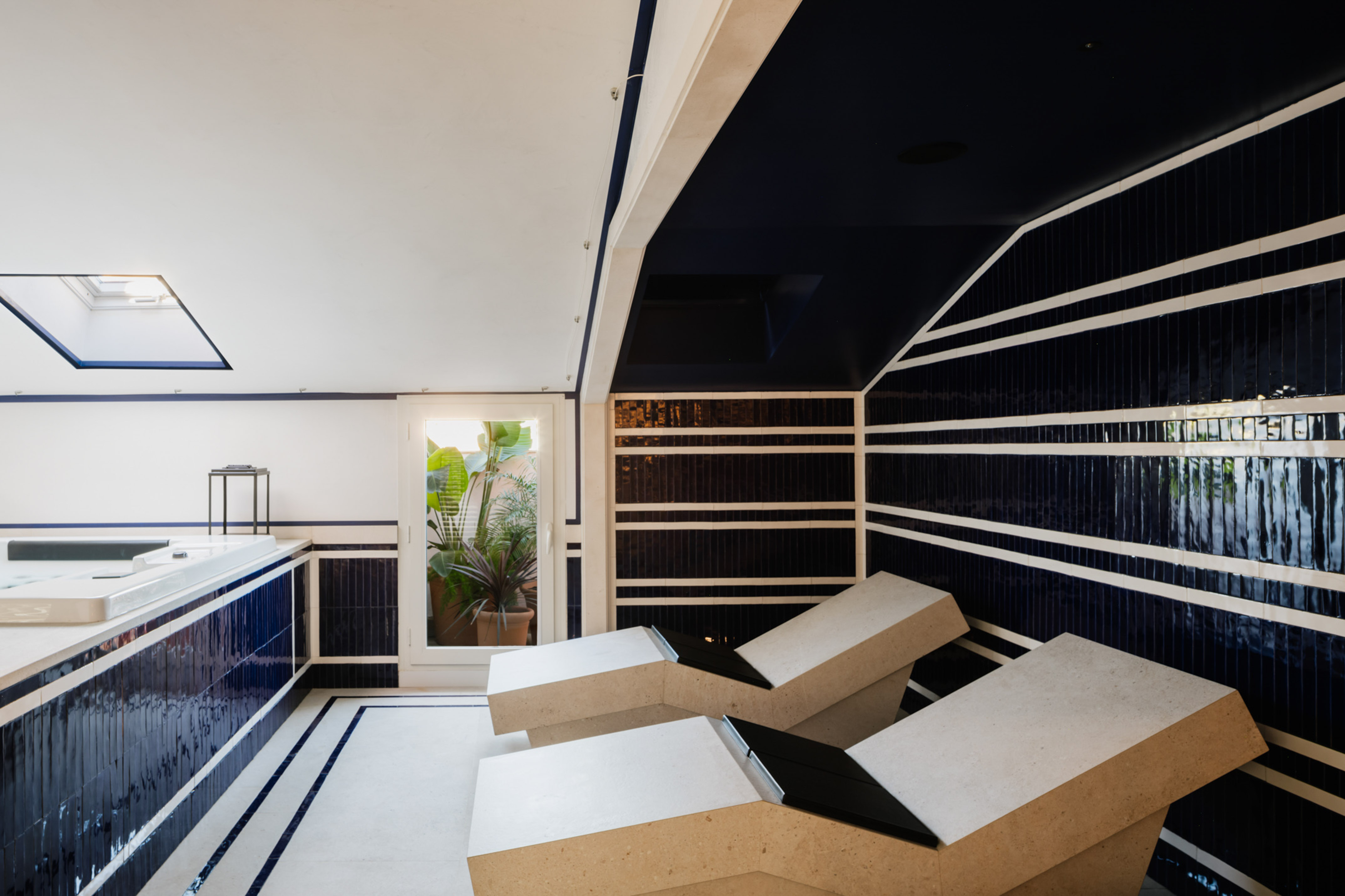 a room with white chairs and blue walls