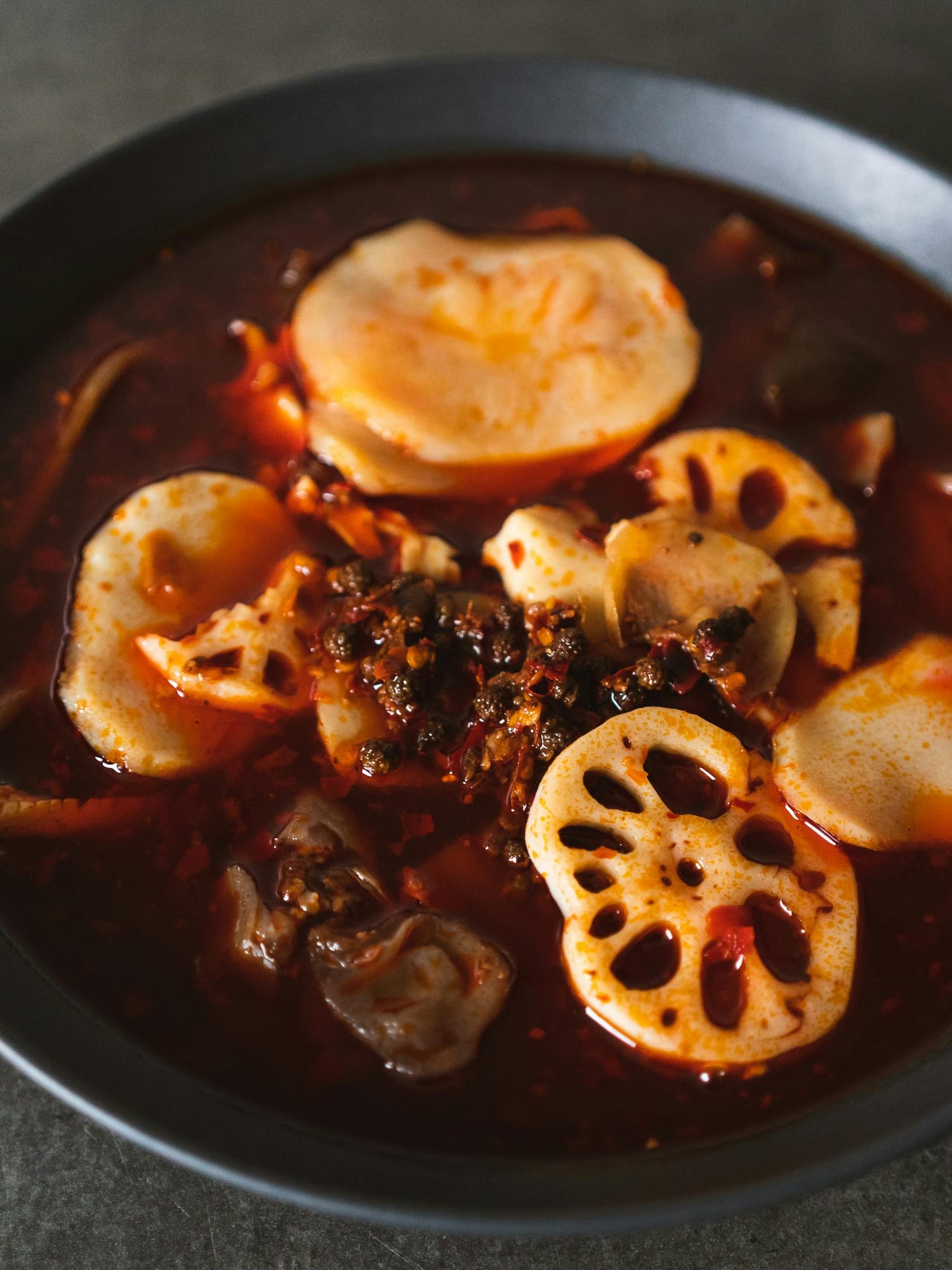 a bowl of soup with vegetables and meat