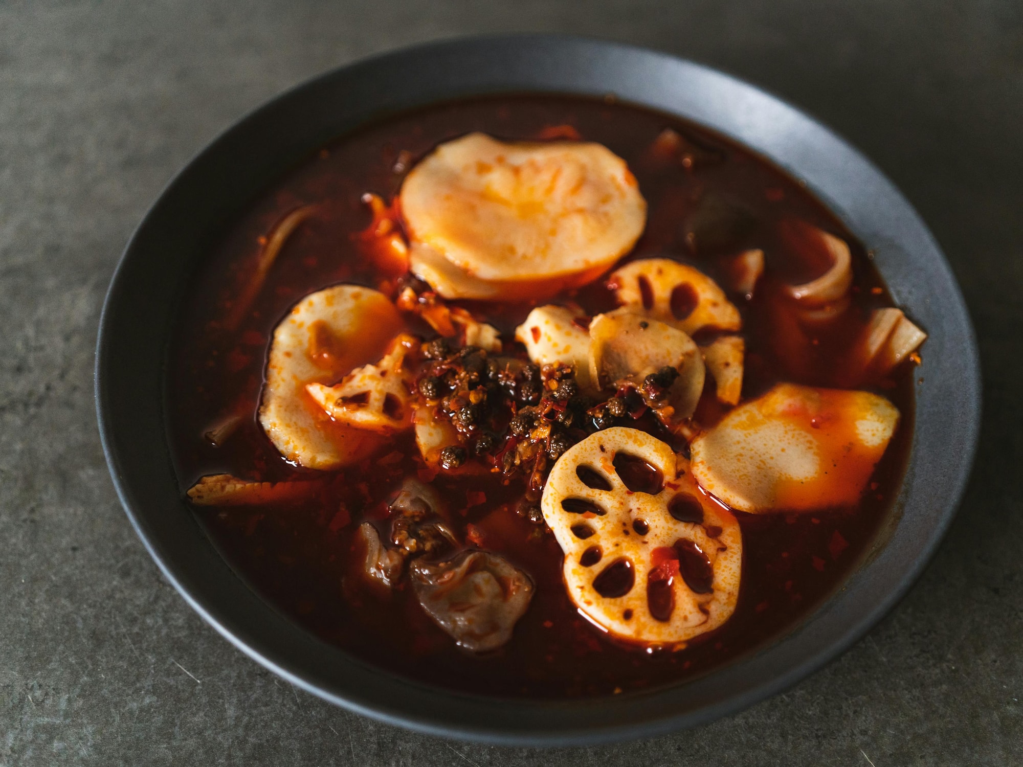a bowl of soup with vegetables and meat