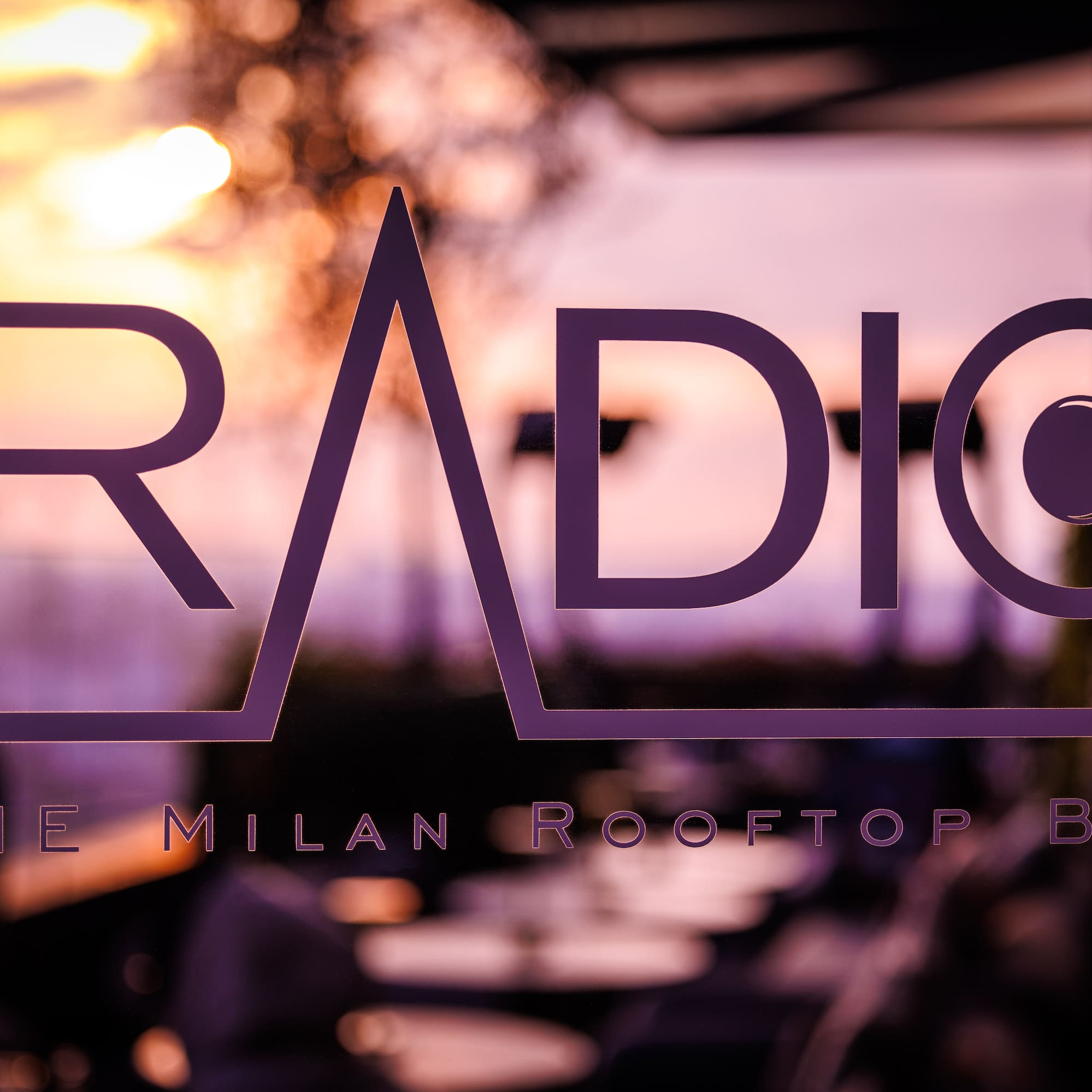 a purple logo on a window