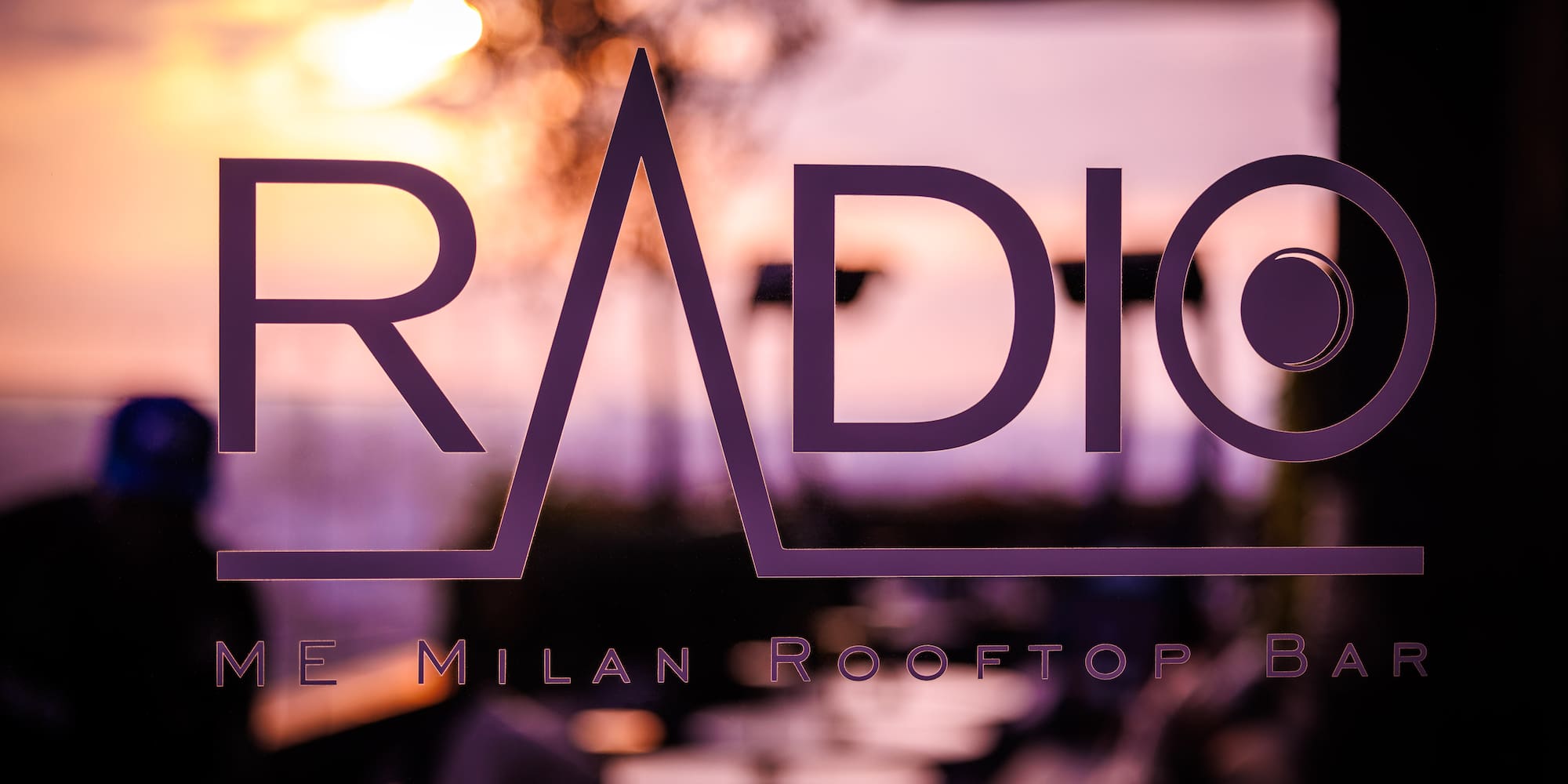 a purple logo on a window