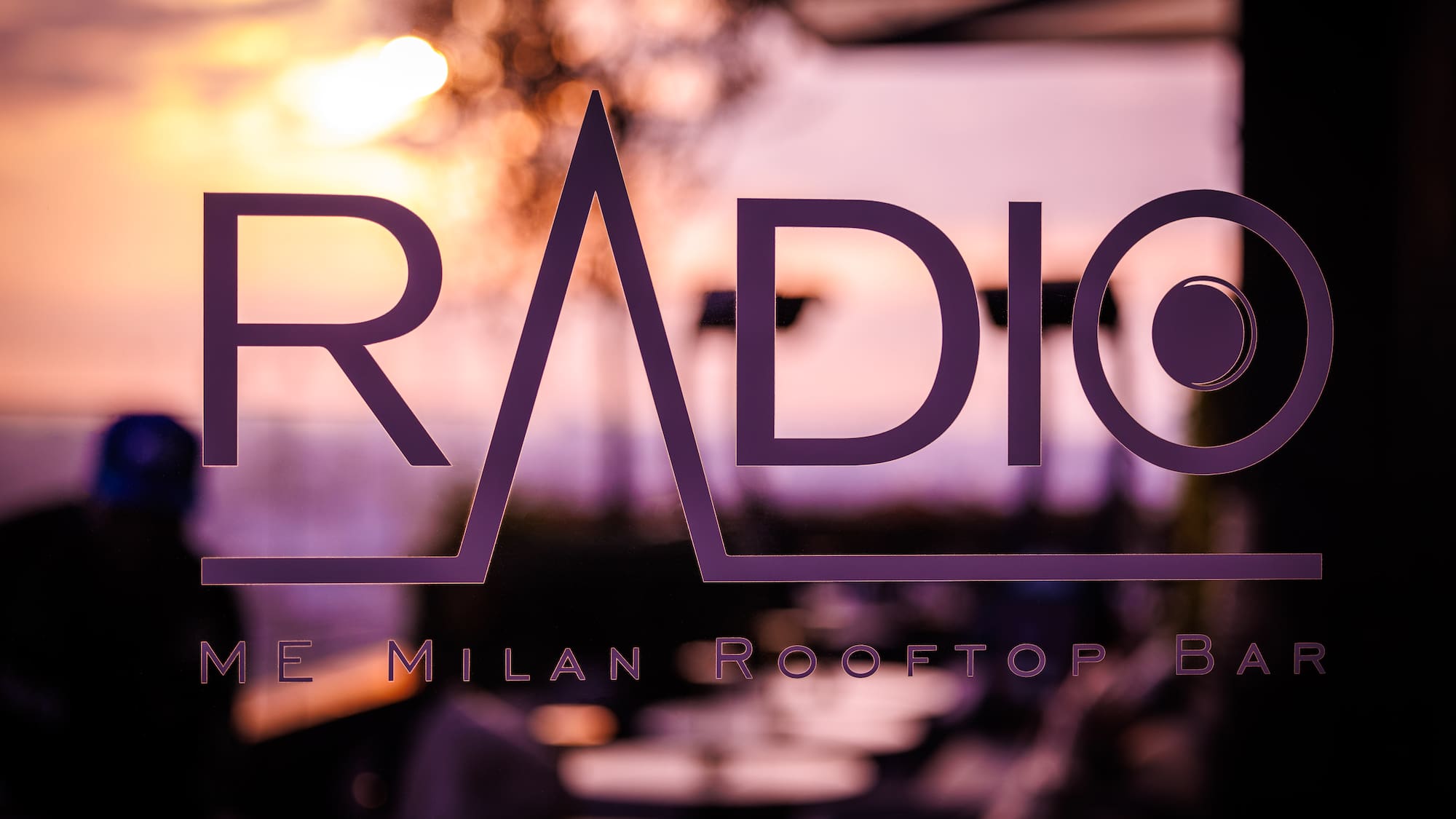 a purple logo on a window