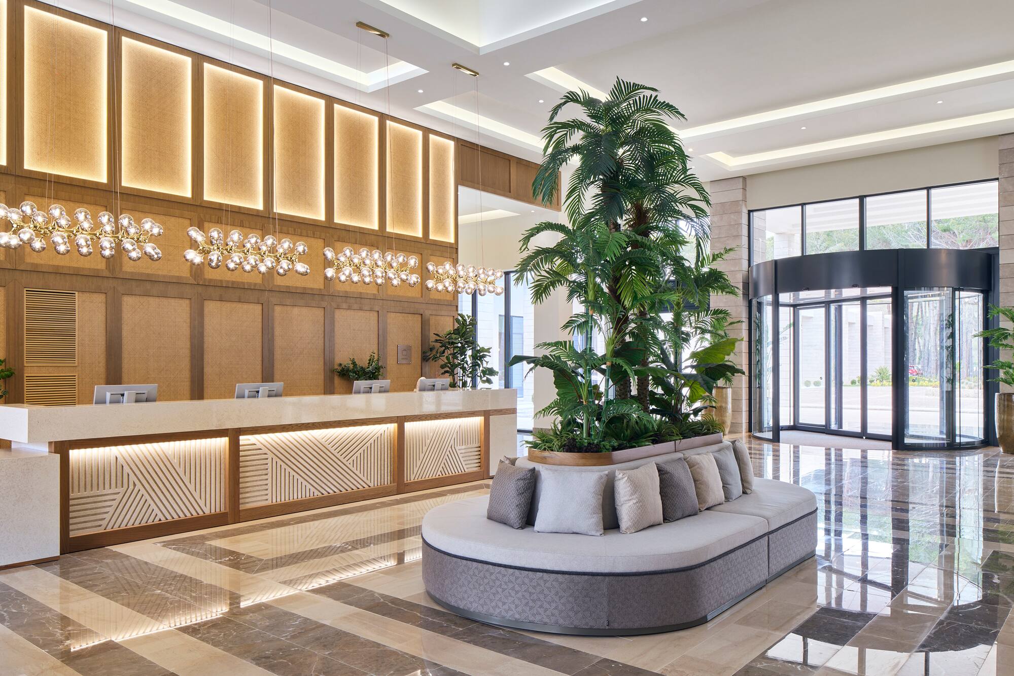 a lobby with a large plant in it