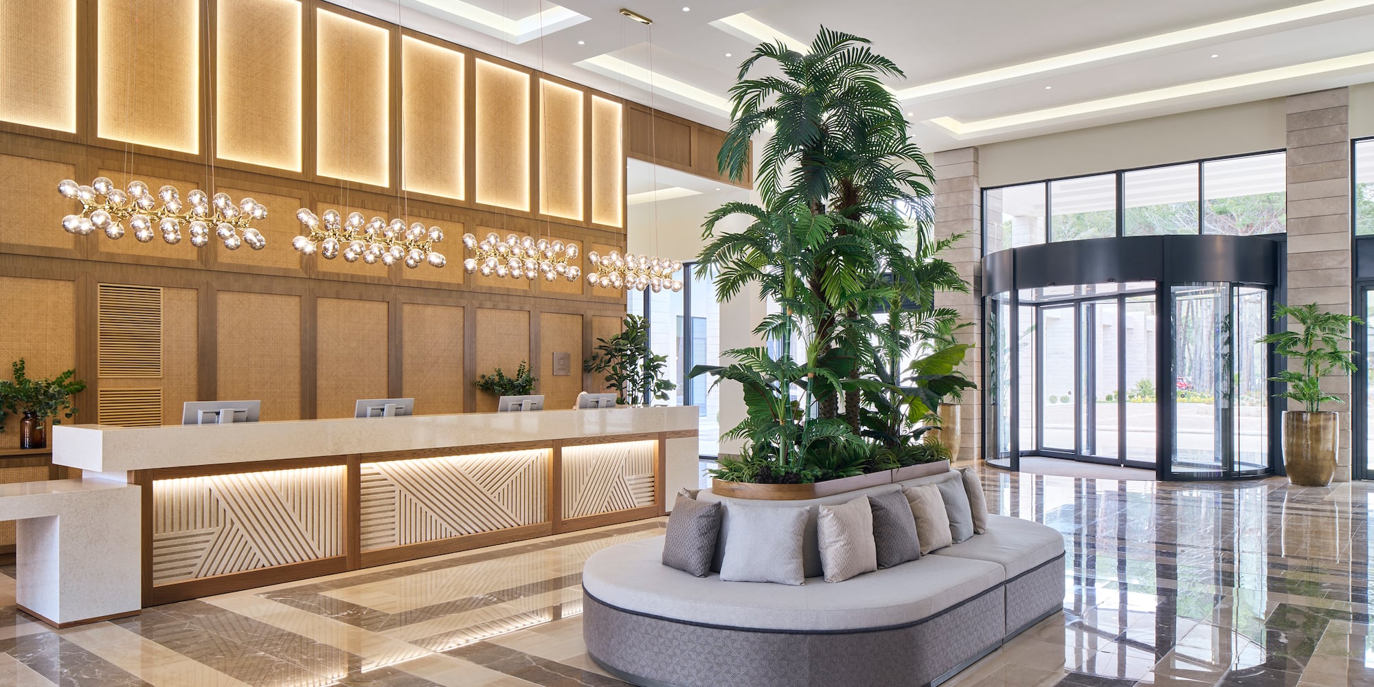 a lobby with a large plant in it