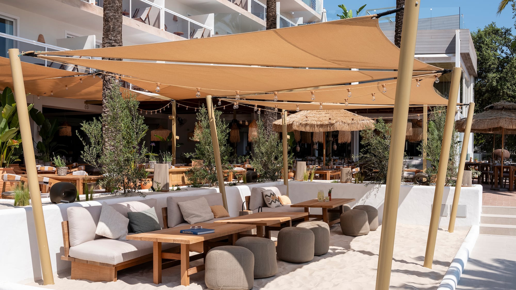 a patio area with a table and chairs and a canopy