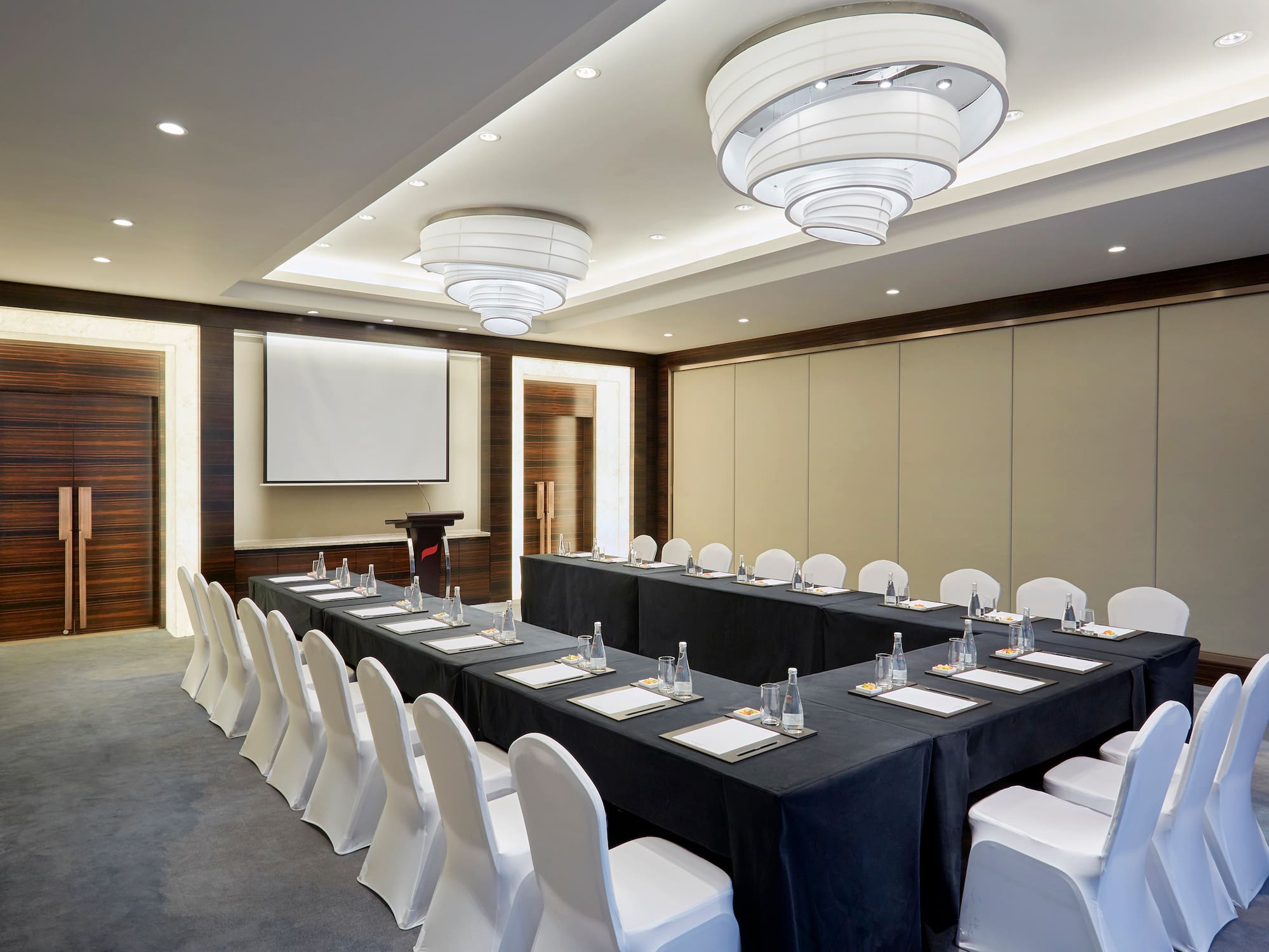 a room with a long table and chairs