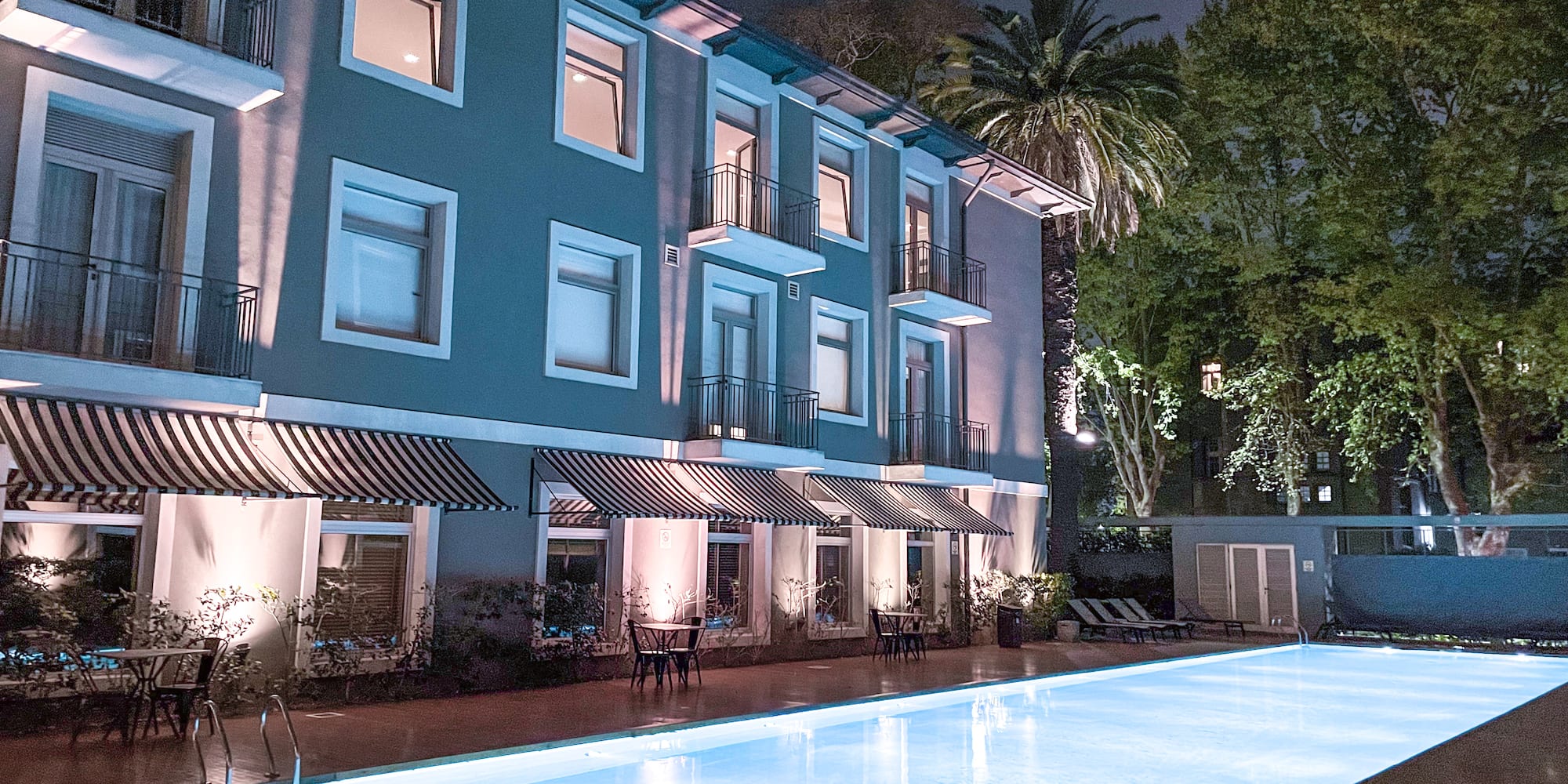 a building with a pool in front of it