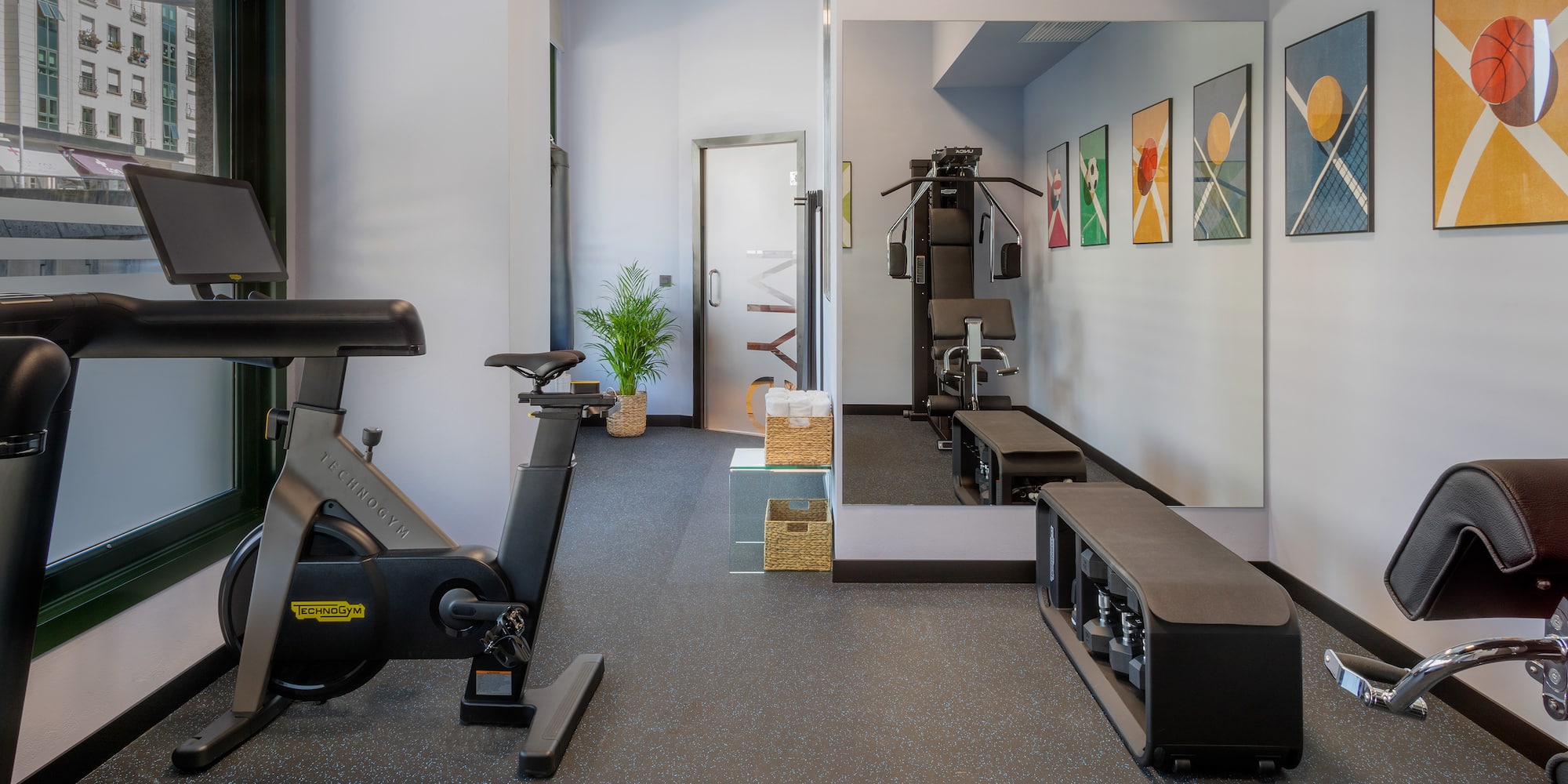 a gym with exercise bikes and mirrors
