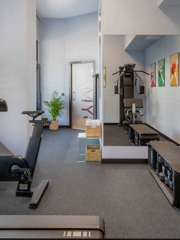 a gym with exercise bikes and mirrors