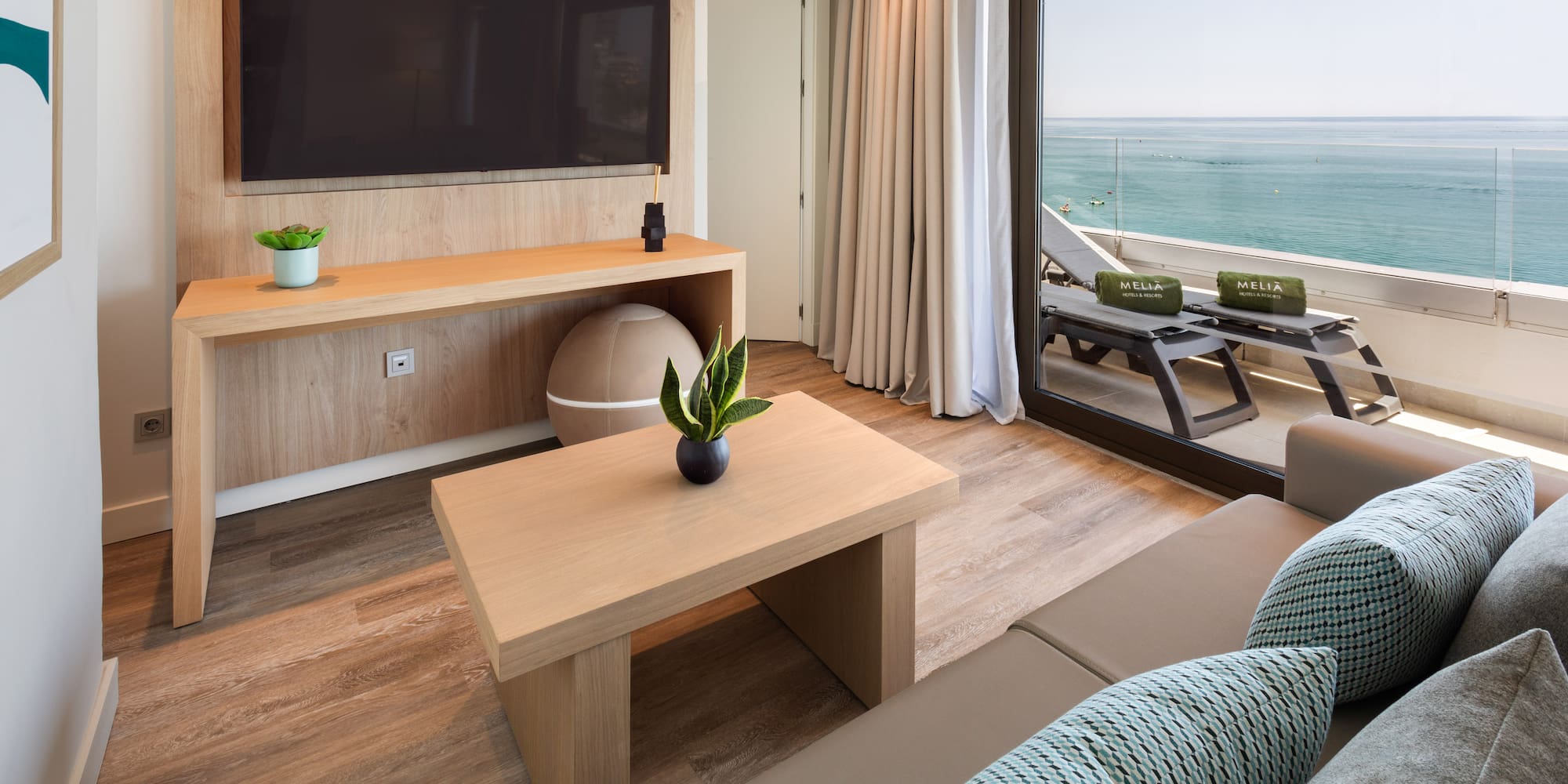 a living room with a television and a couch