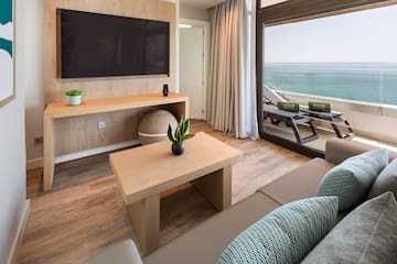 a living room with a television and a couch