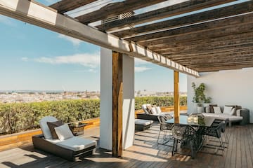 a patio with a table and chairs
