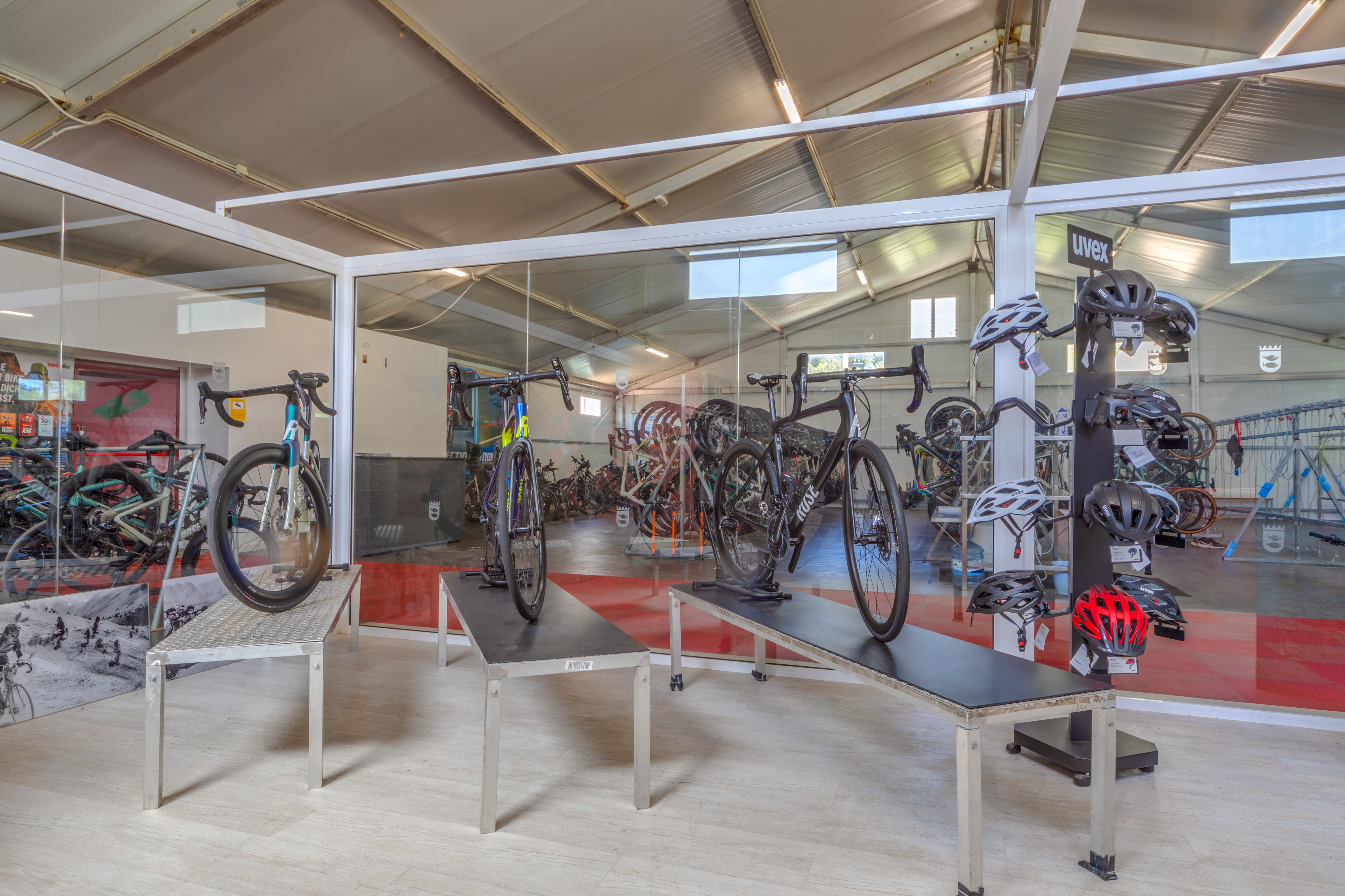 a room with bikes and helmets