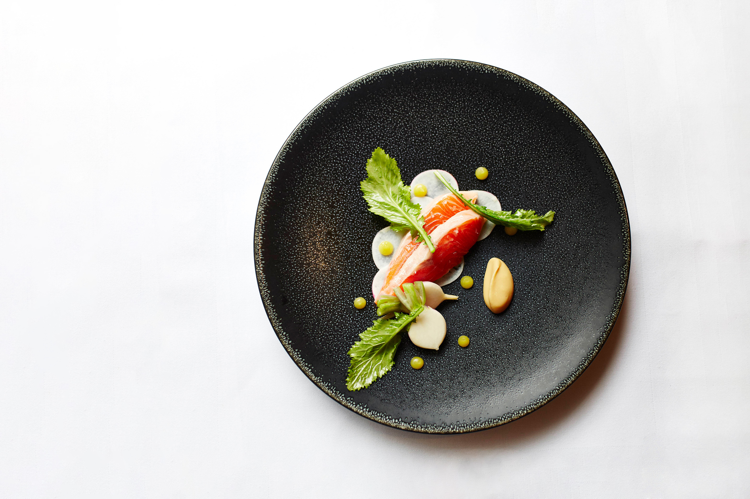 a plate of food on a white surface