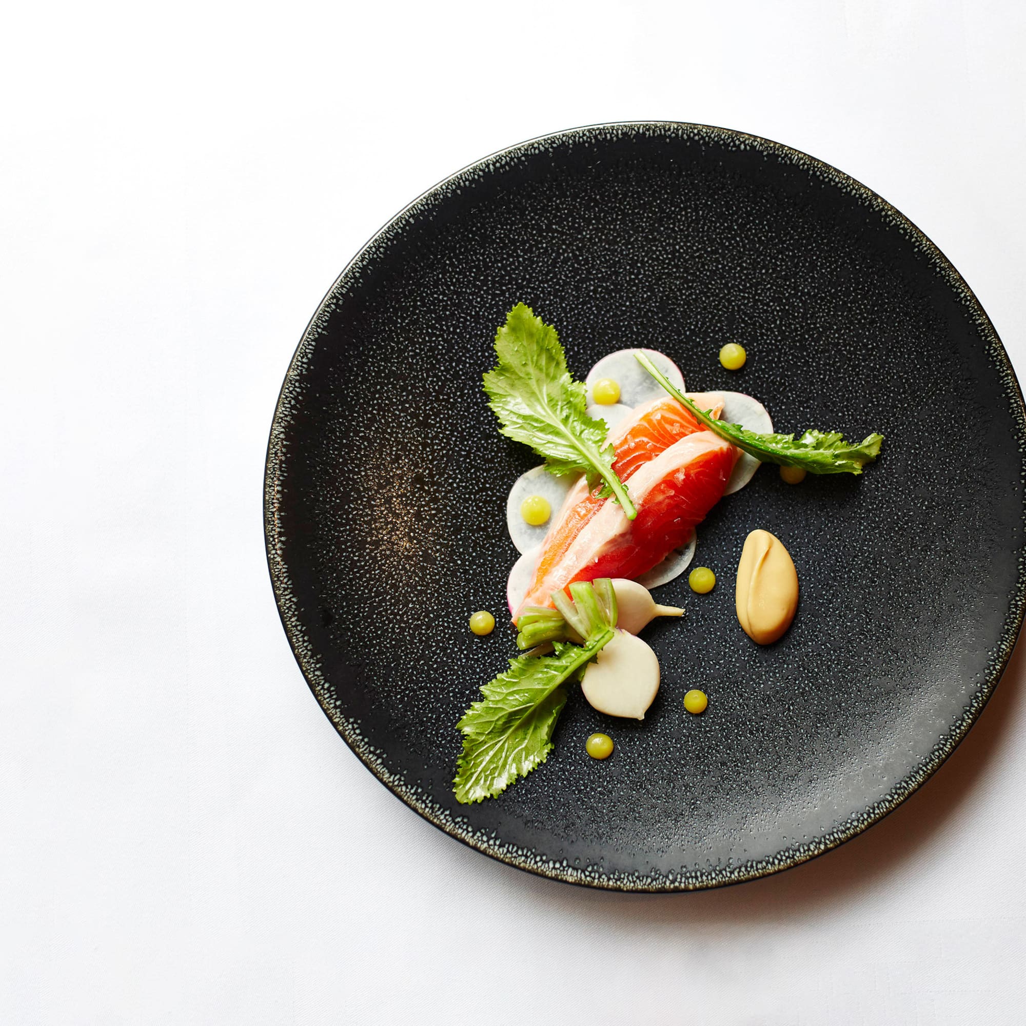 a plate of food on a white surface