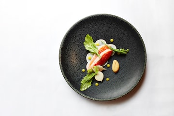 a plate of food on a white surface