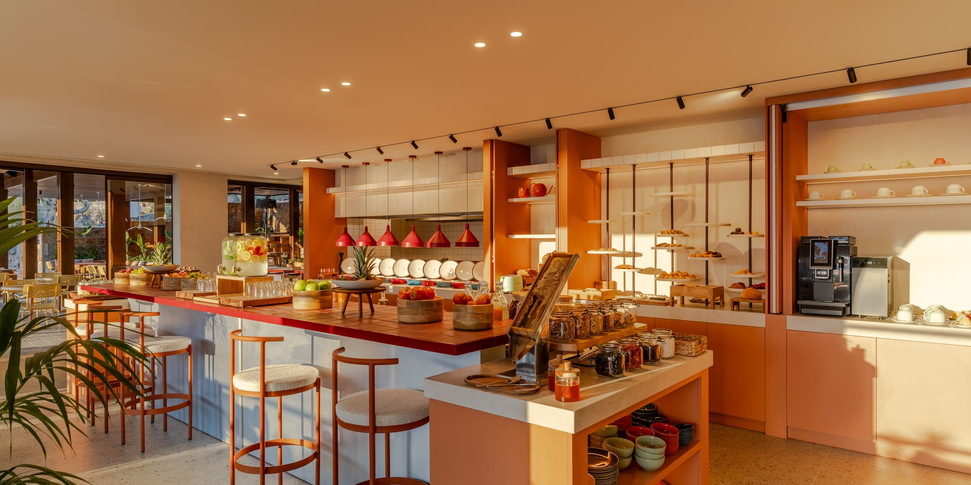 a kitchen with a counter and stools