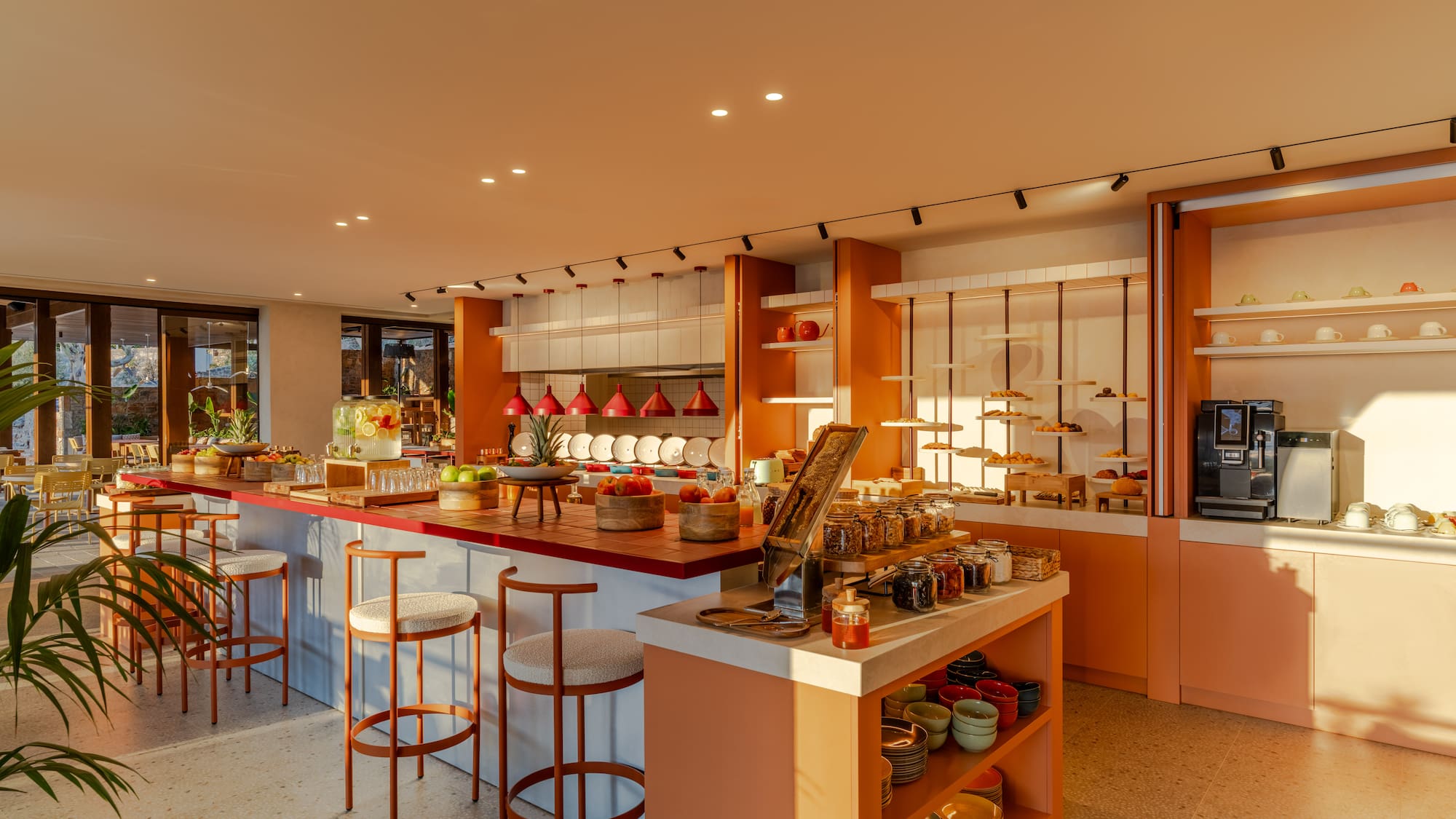 a kitchen with a counter and stools