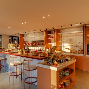 a kitchen with a counter and stools