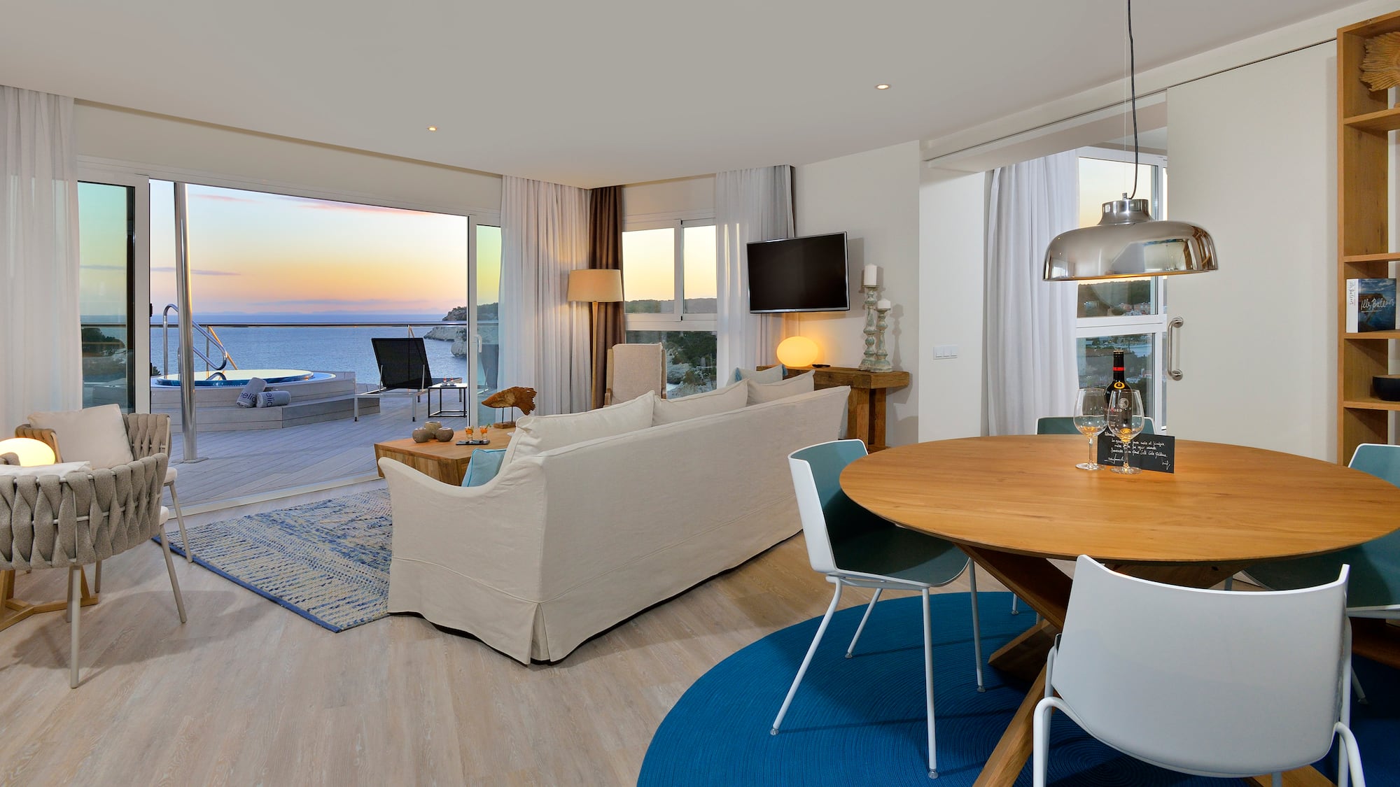 a living room with a table and chairs