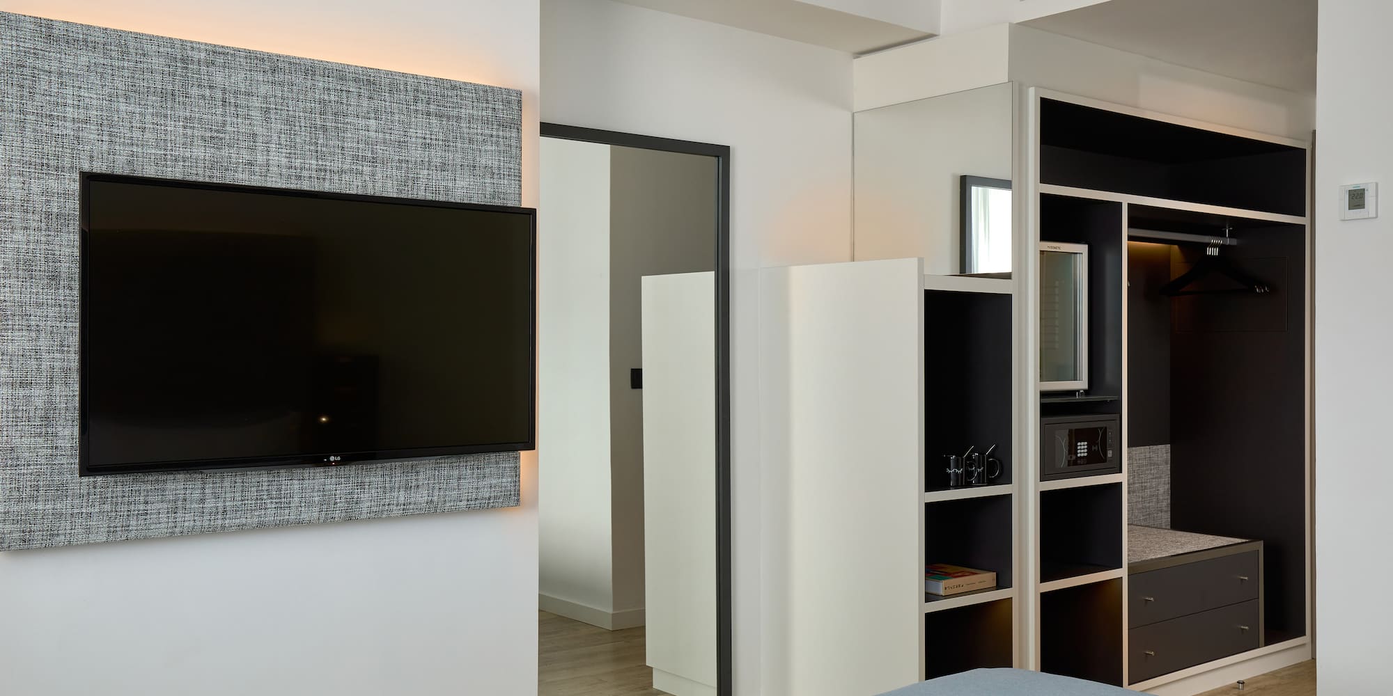 a room with a tv on the wall