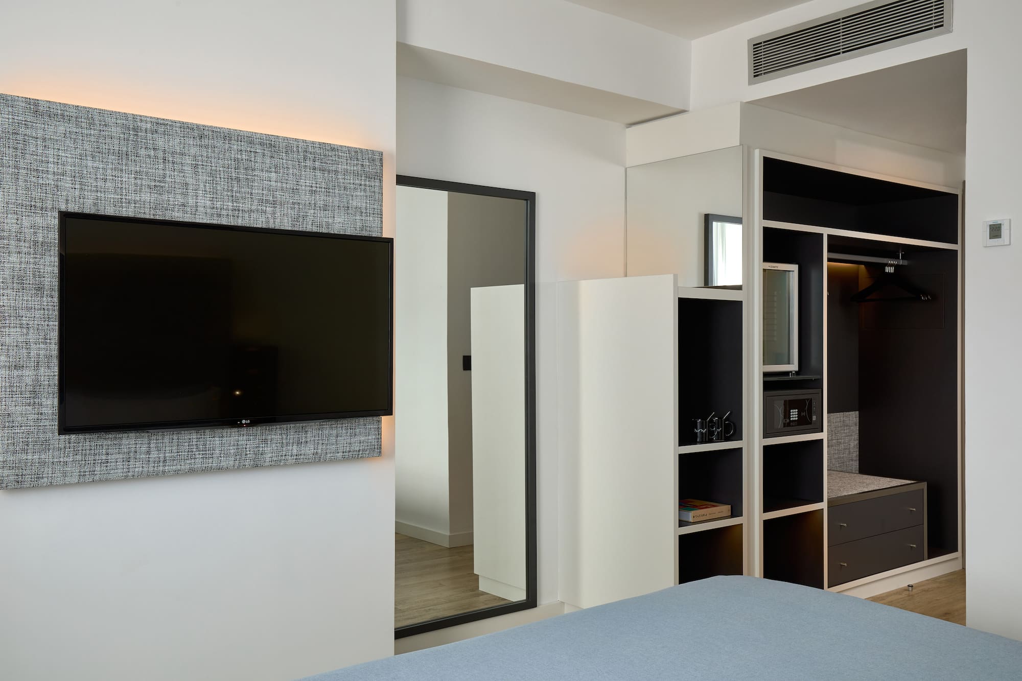 a room with a tv on the wall