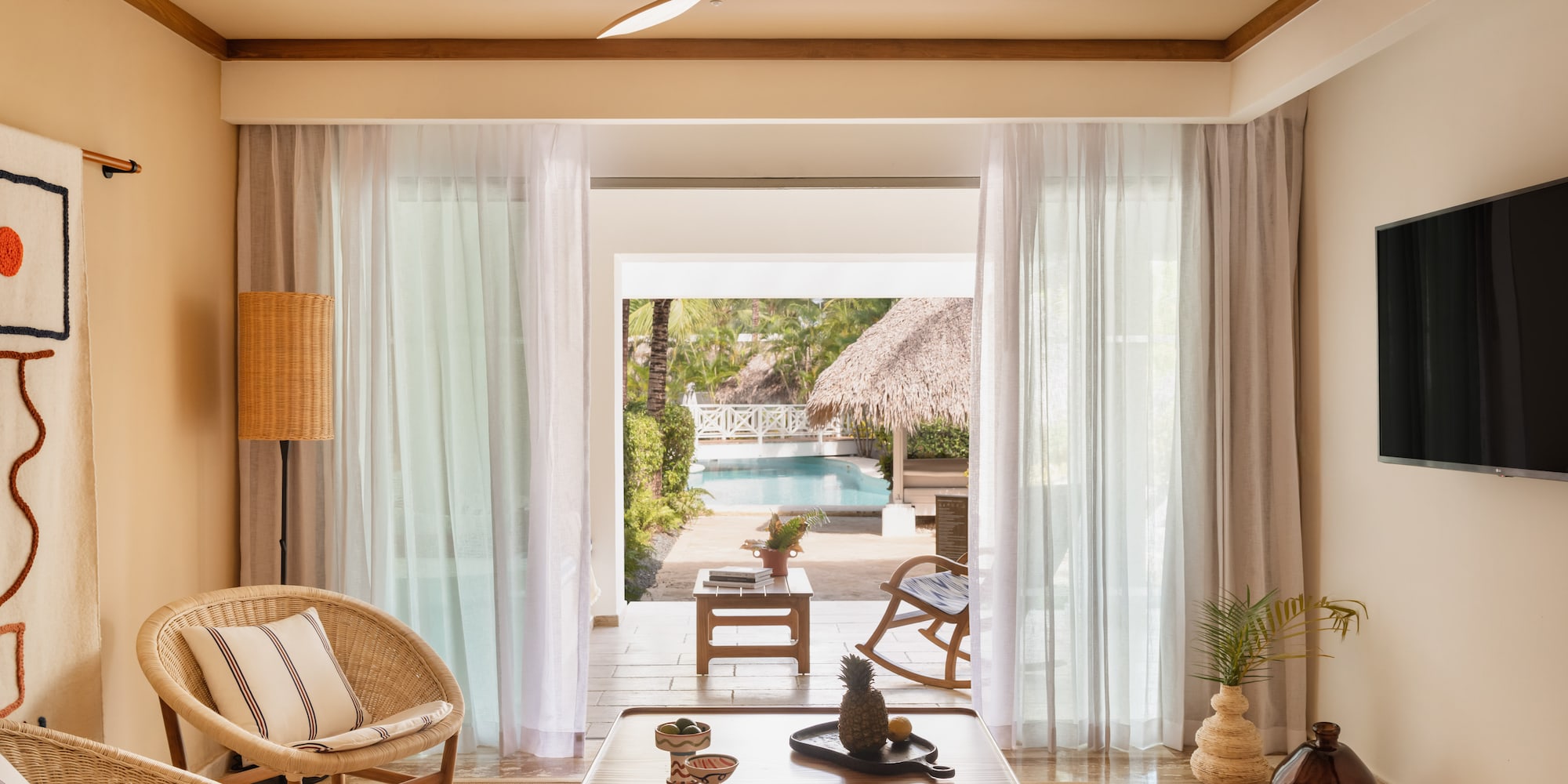 a living room with a table and chairs
