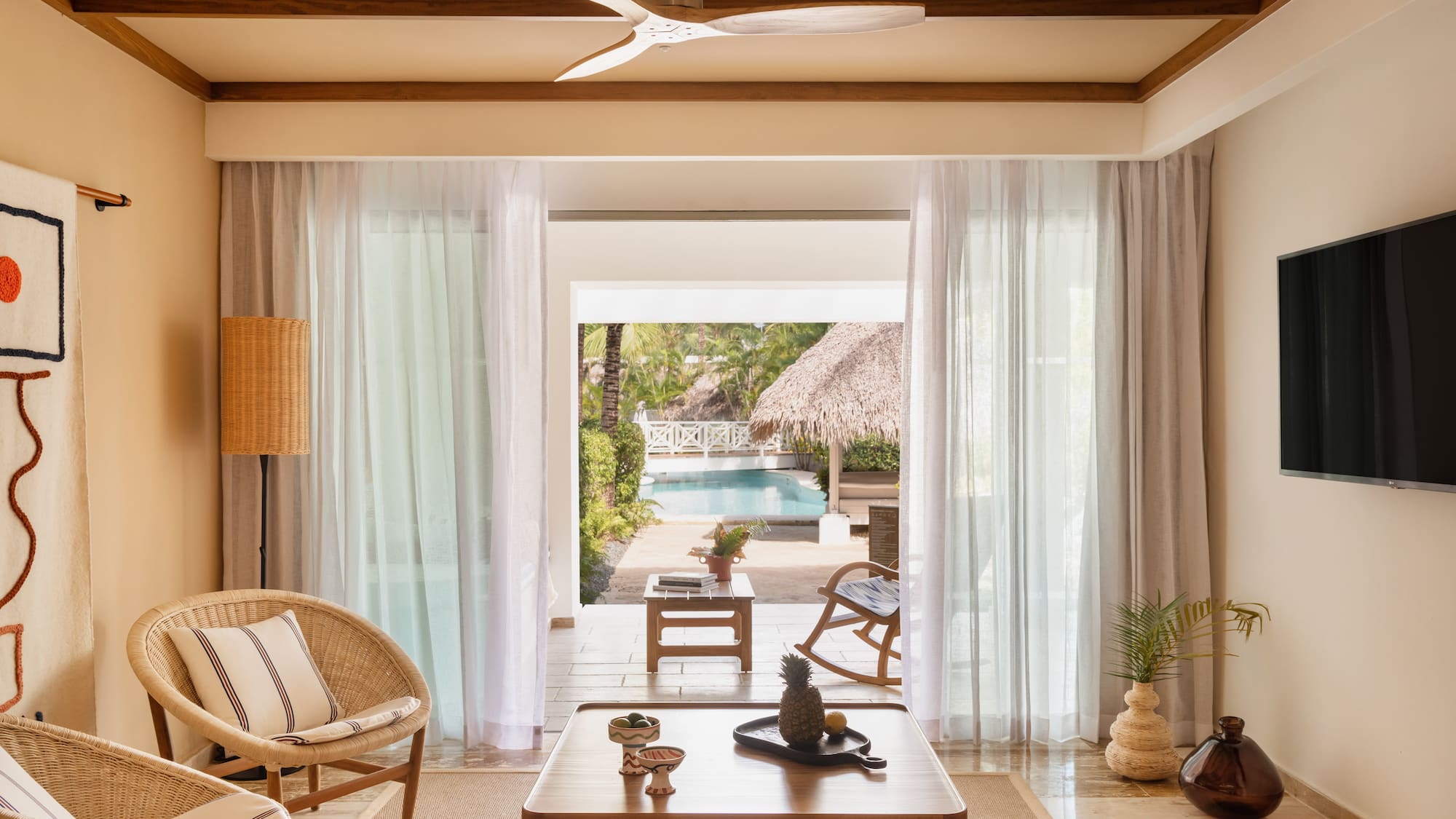 a living room with a table and chairs