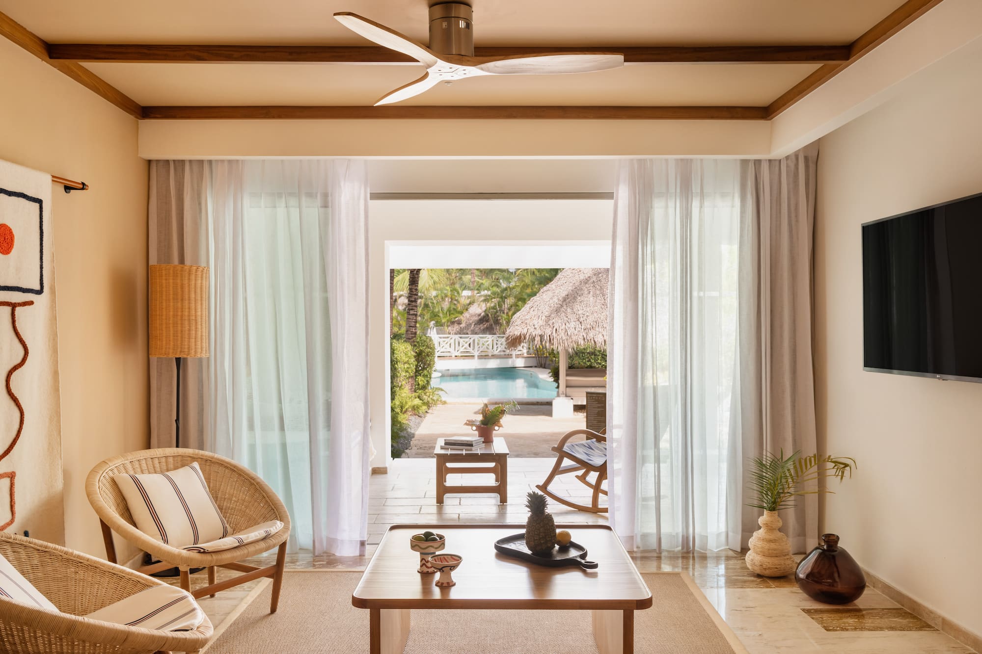 a living room with a table and chairs