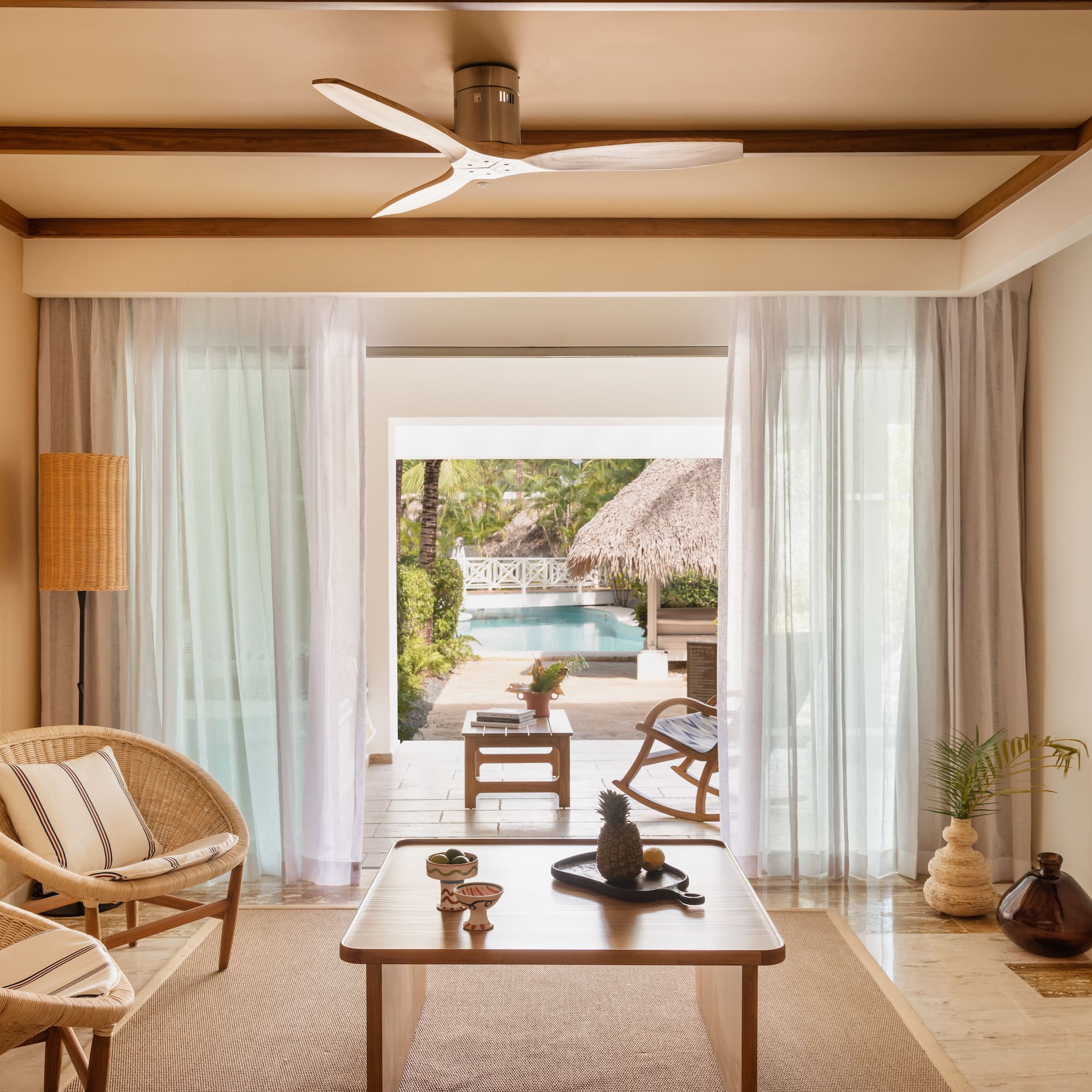 a living room with a table and chairs