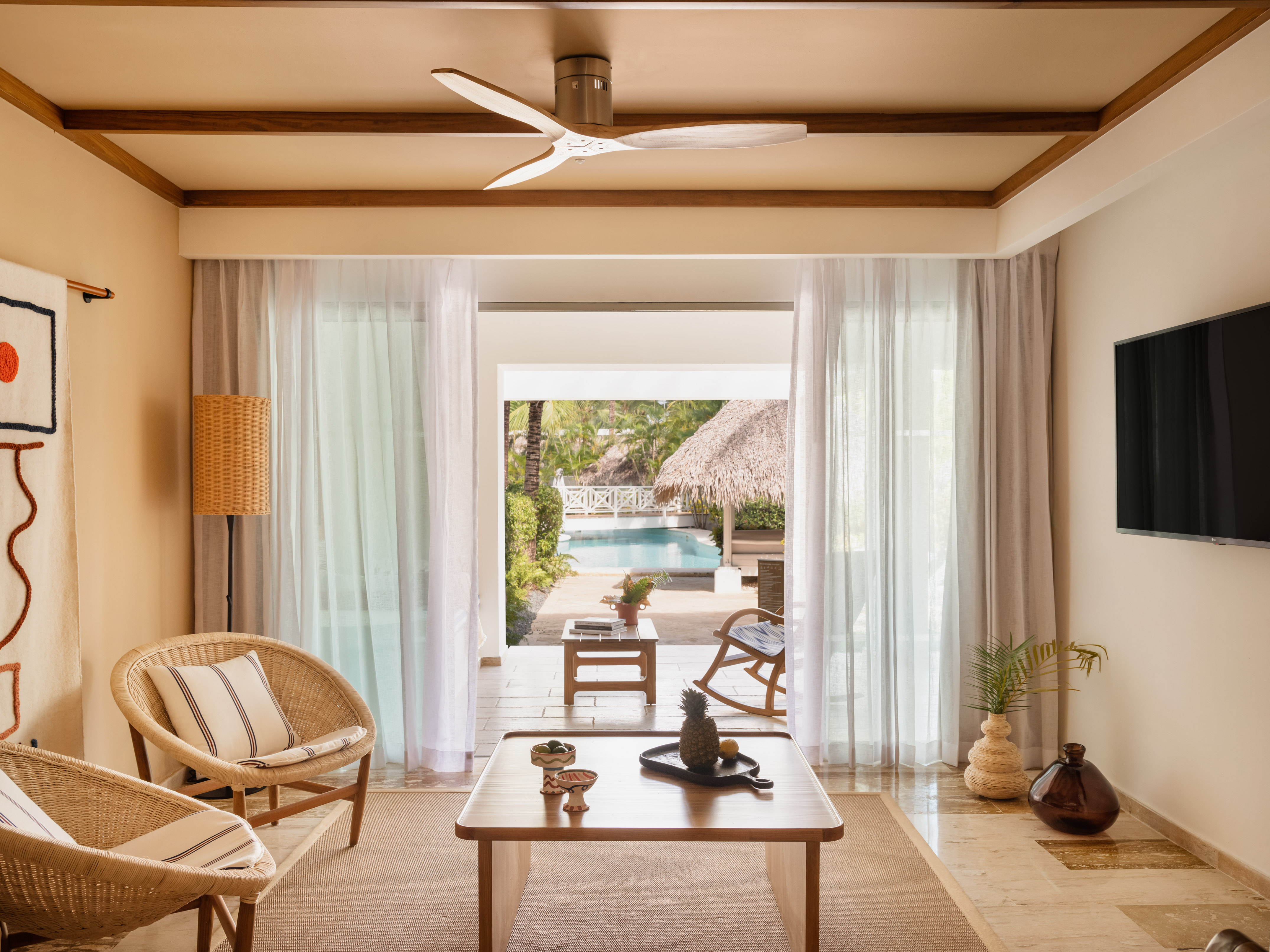 a living room with a table and chairs