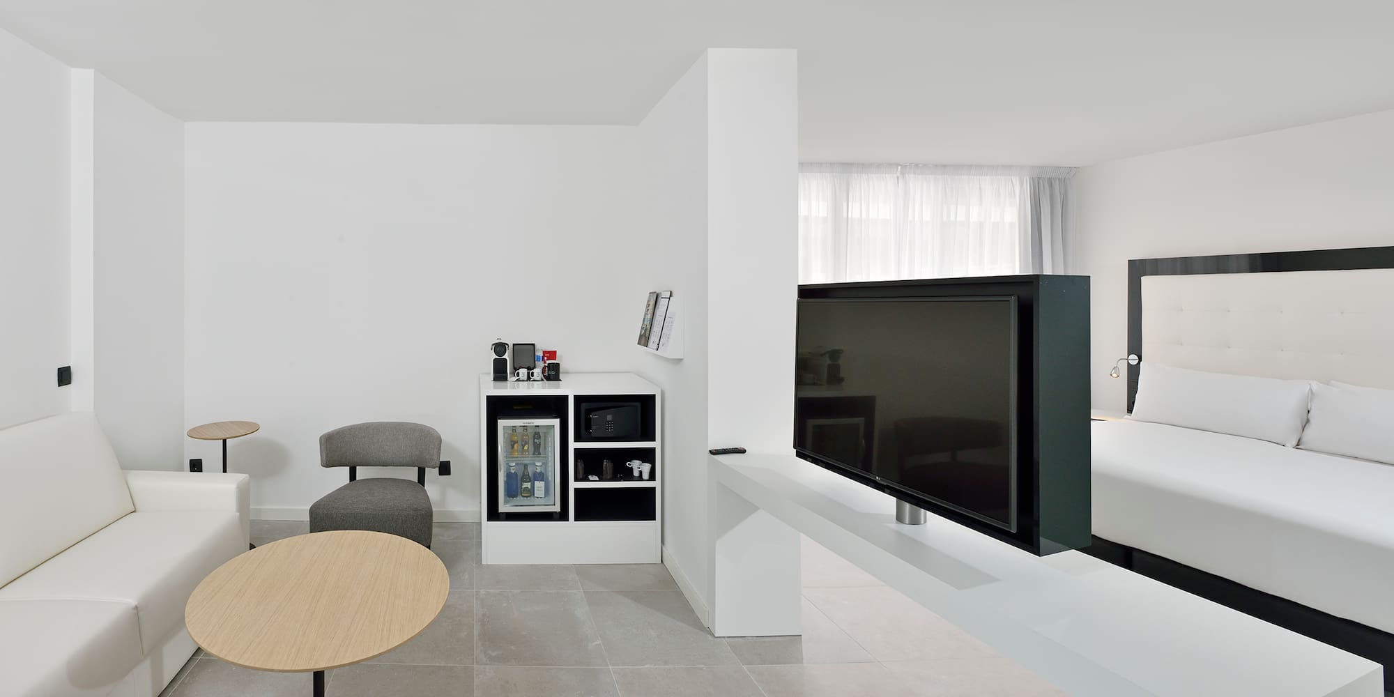 a tv on a white table in a room