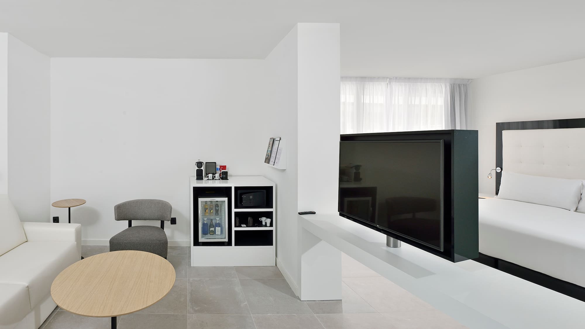 a tv on a white table in a room