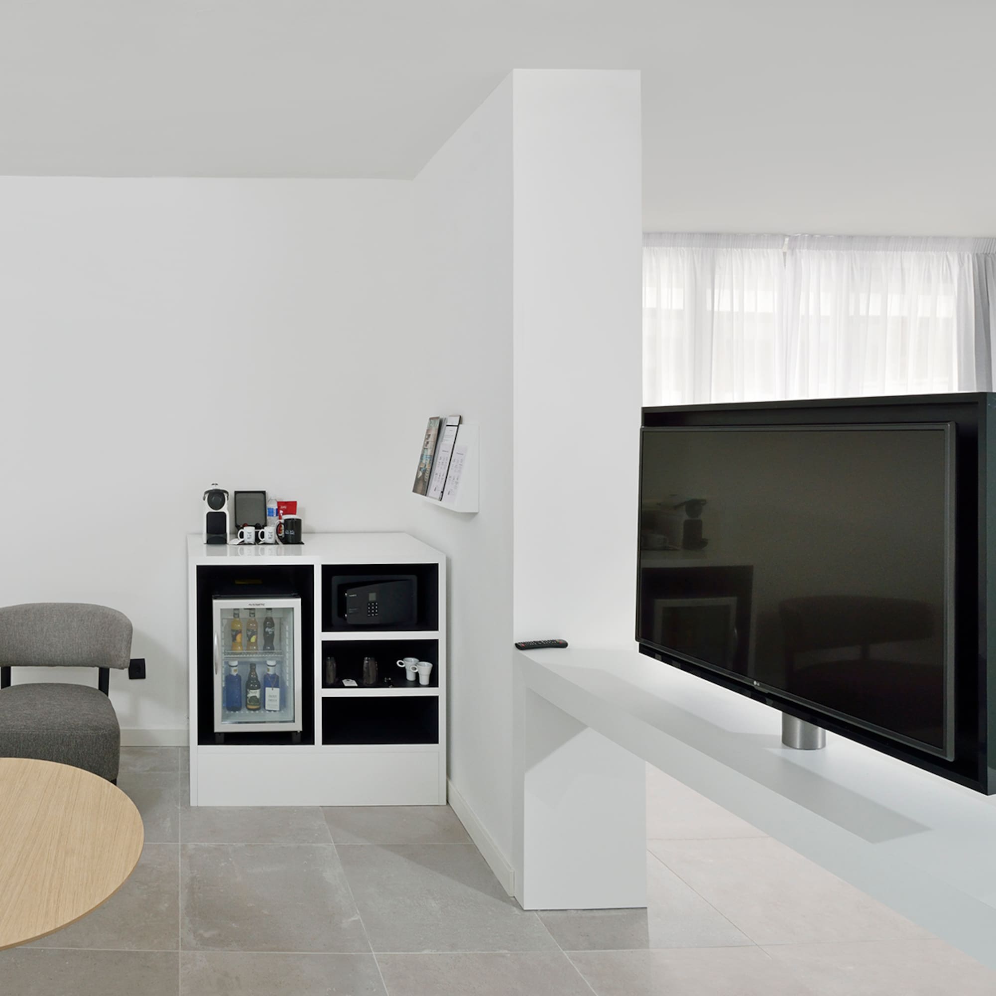 a tv on a white table in a room