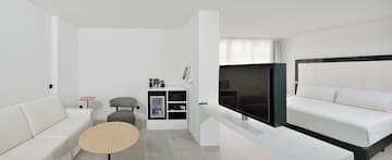 a tv on a white table in a room
