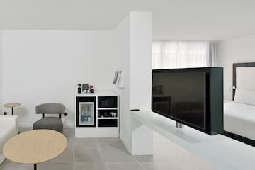 a tv on a white table in a room