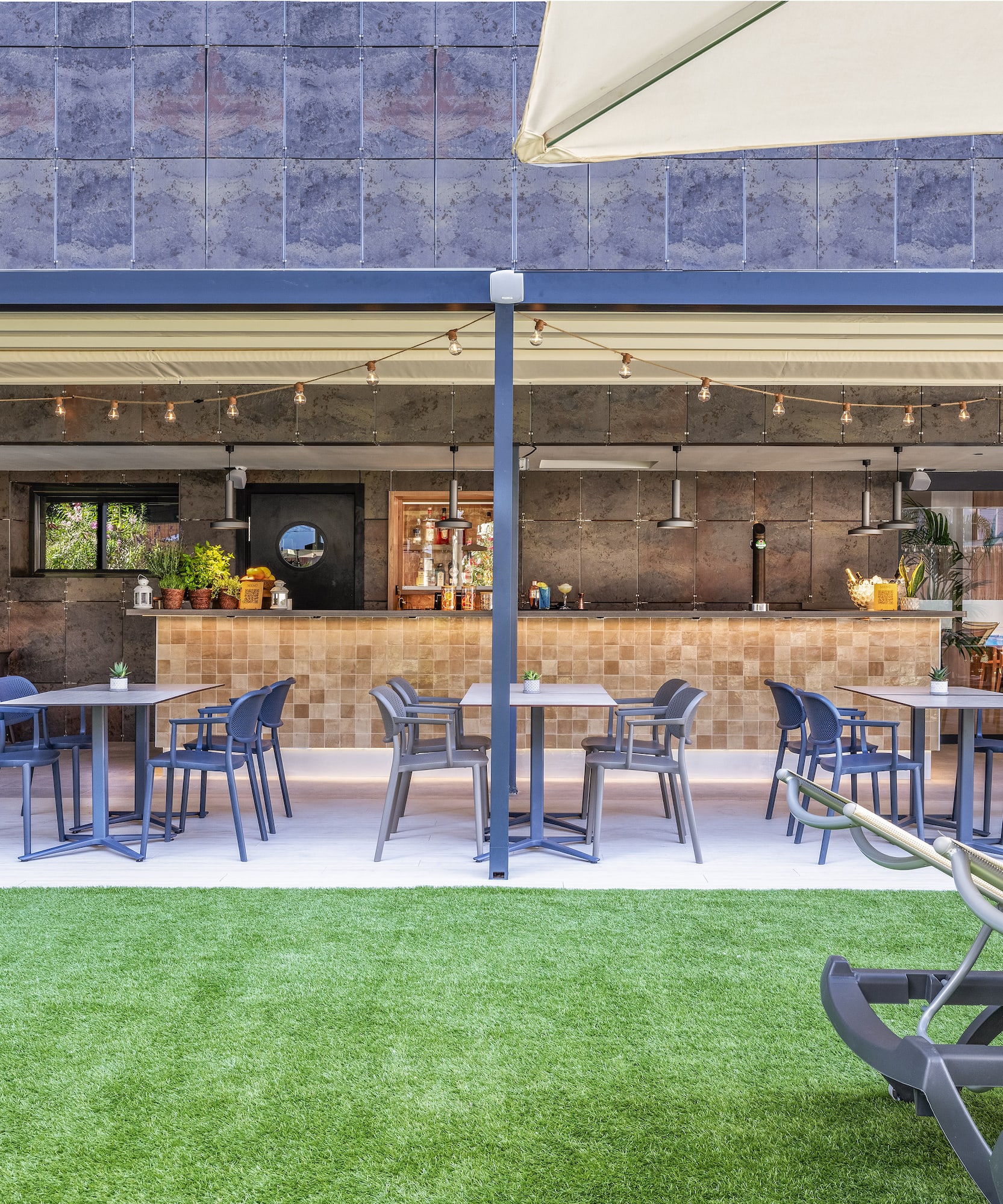 a patio with tables and chairs