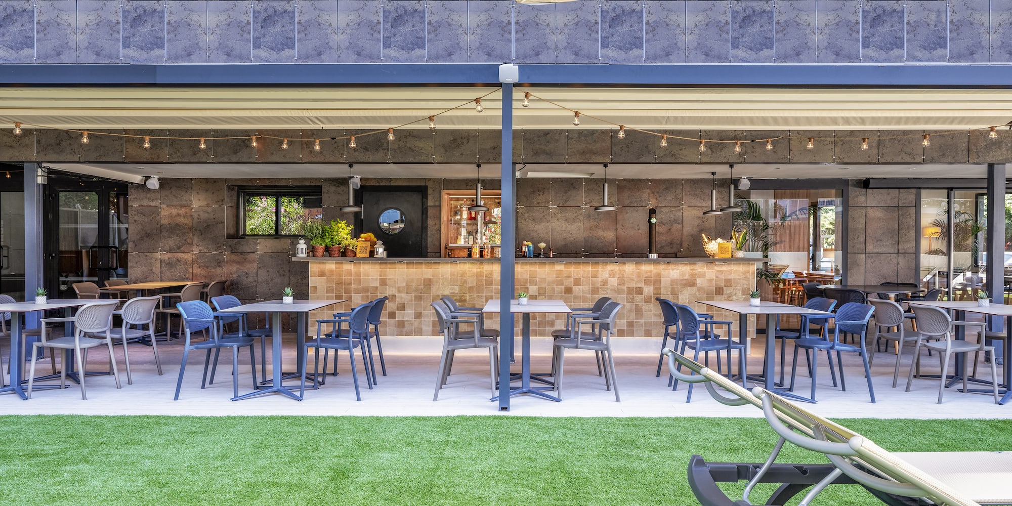 a patio with tables and chairs