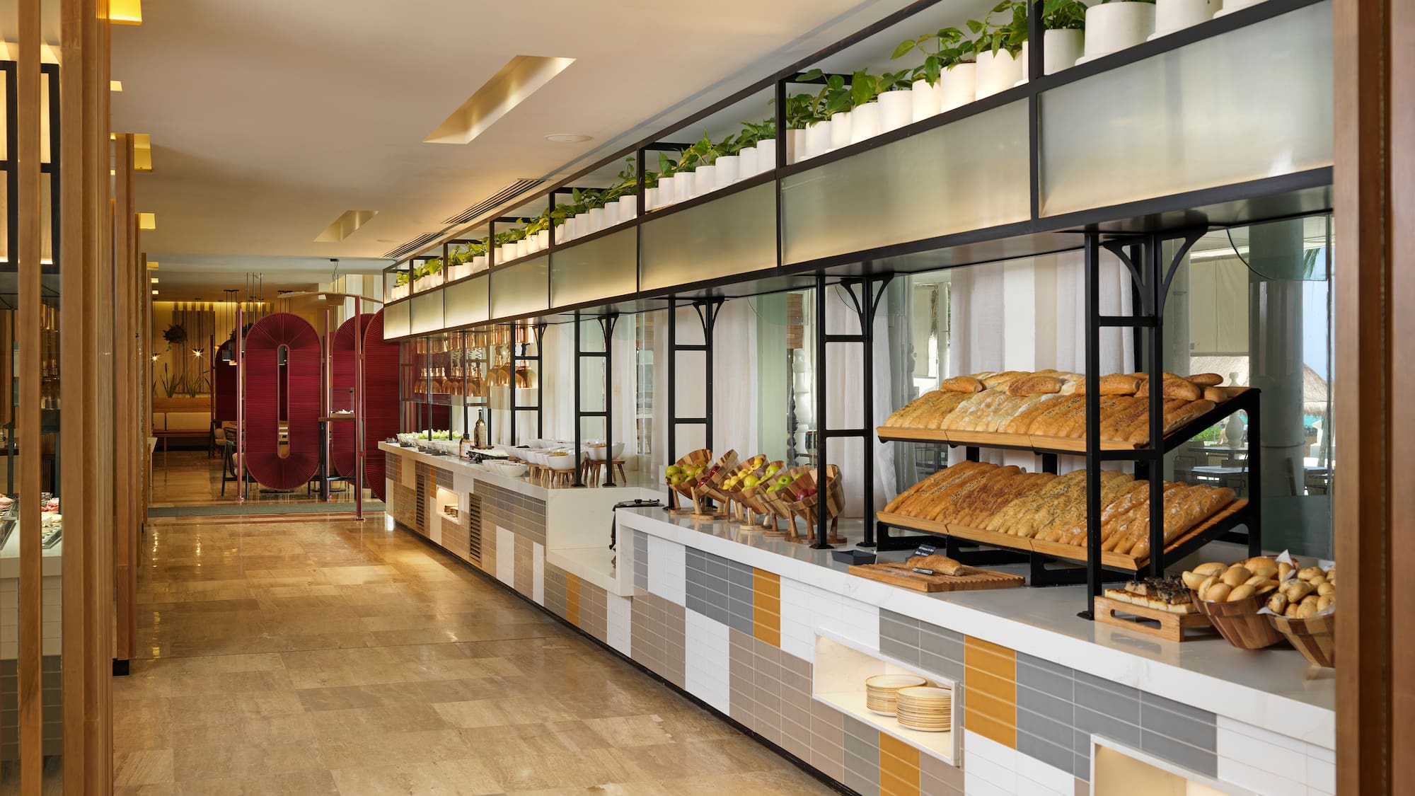 a food buffet with a variety of breads on shelves
