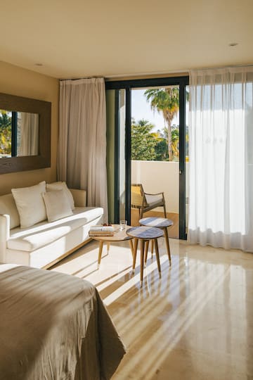 a room with a couch and a sofa