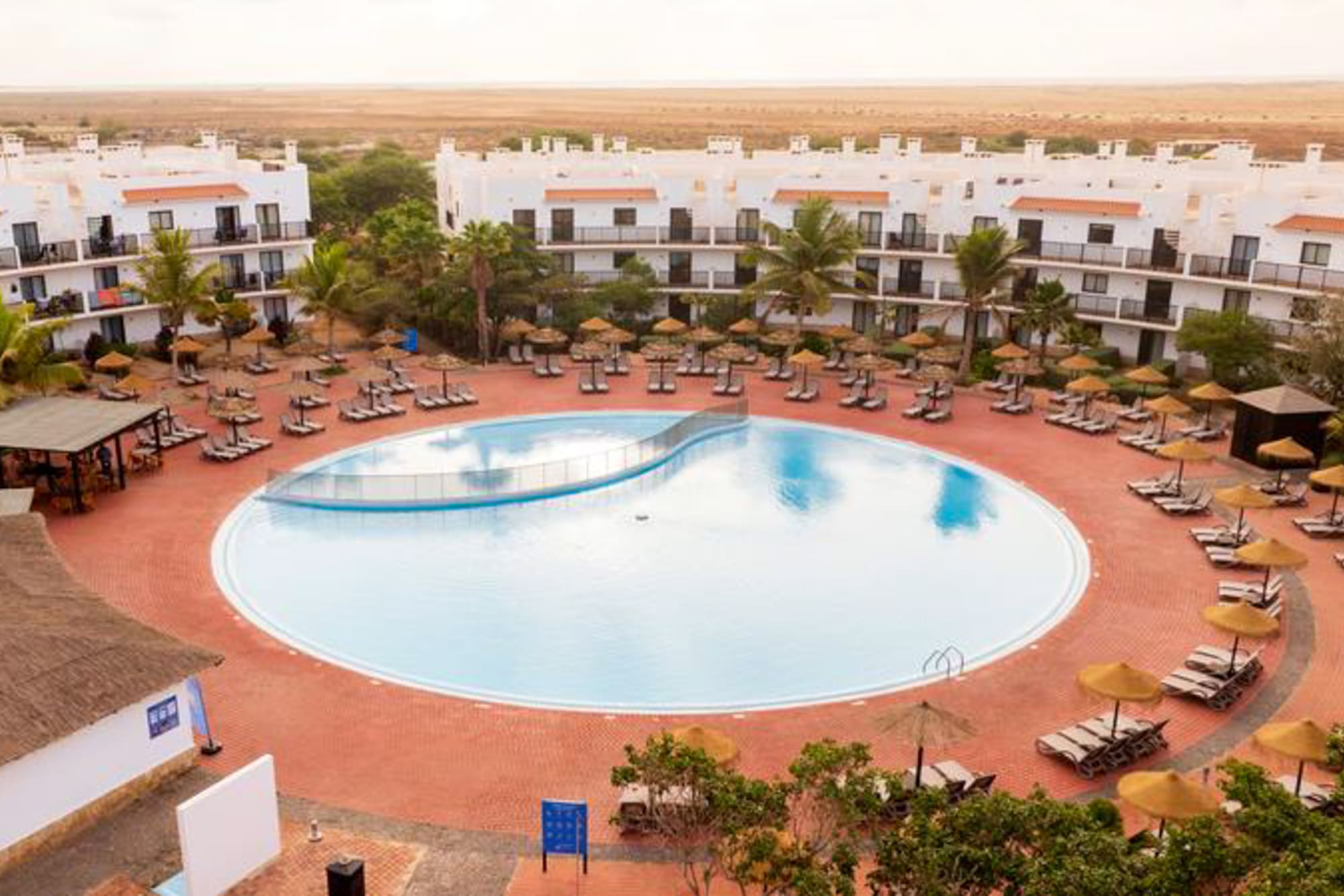 a building with palm trees in front of it