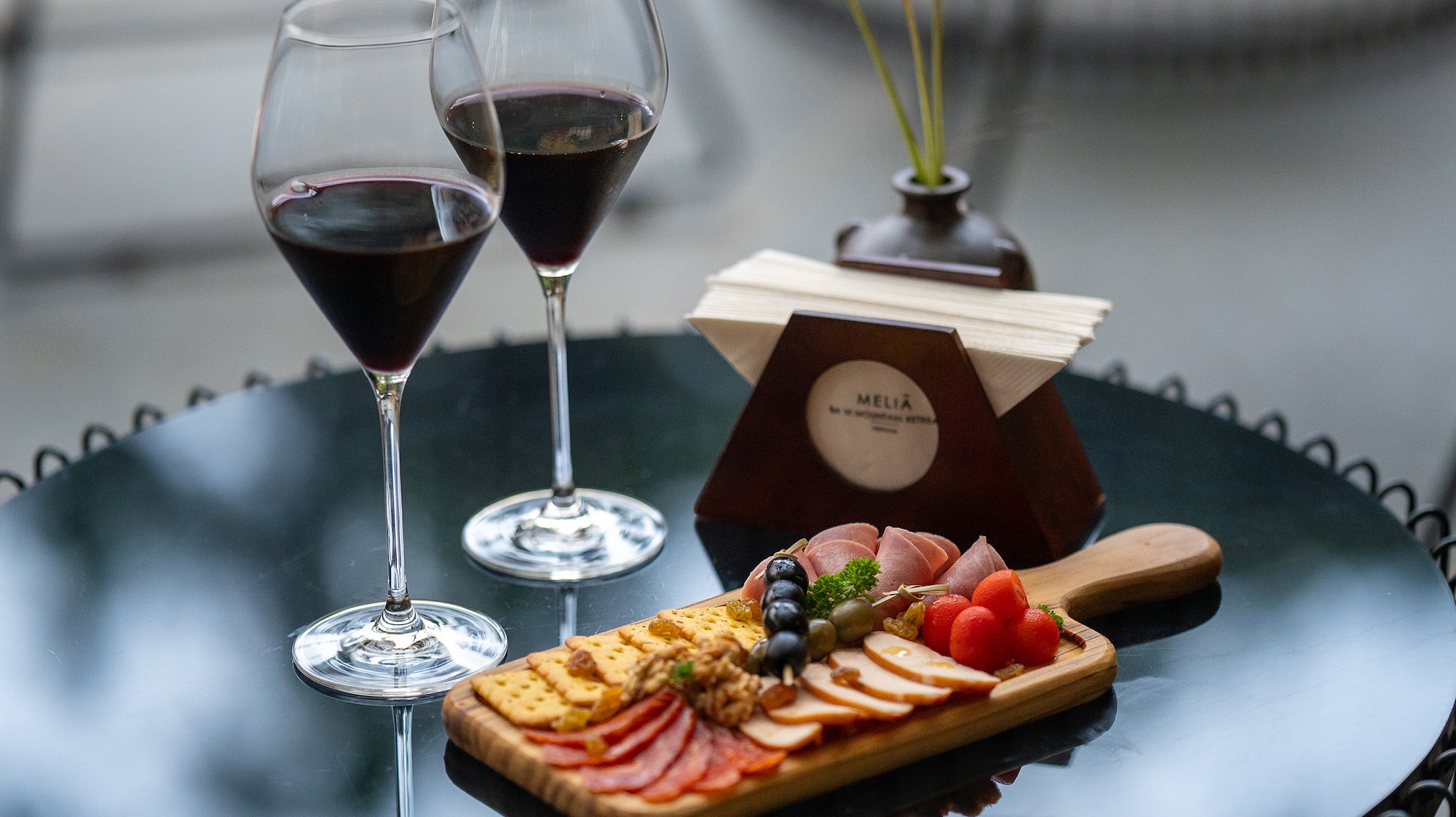 a table with wine glasses and food on it